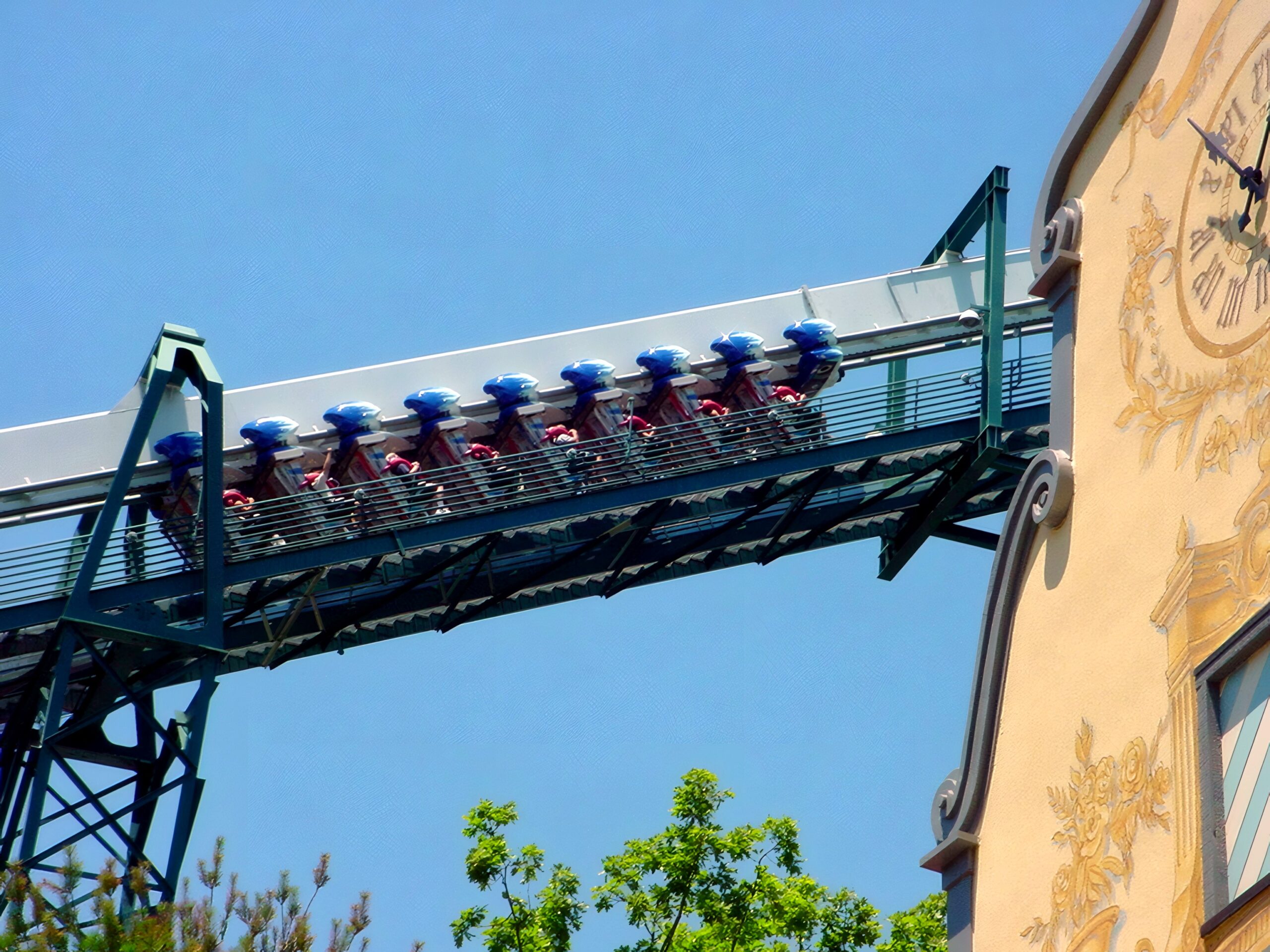 An Alpengeist train on the lift hill above the village clock tower, July 2001