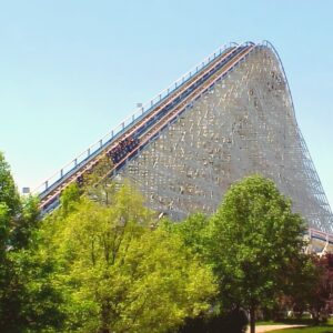 American Eagle at Six Flags Great America: a train climbing the wooden lift hill above the trees