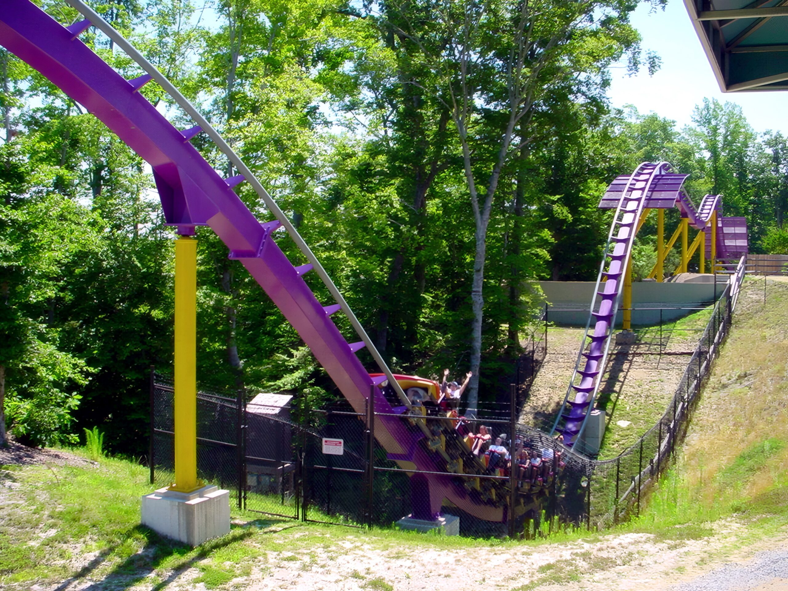 An Apollo's Chariot train at the bottom of the 210-foot first drop in the ravine, July 2001