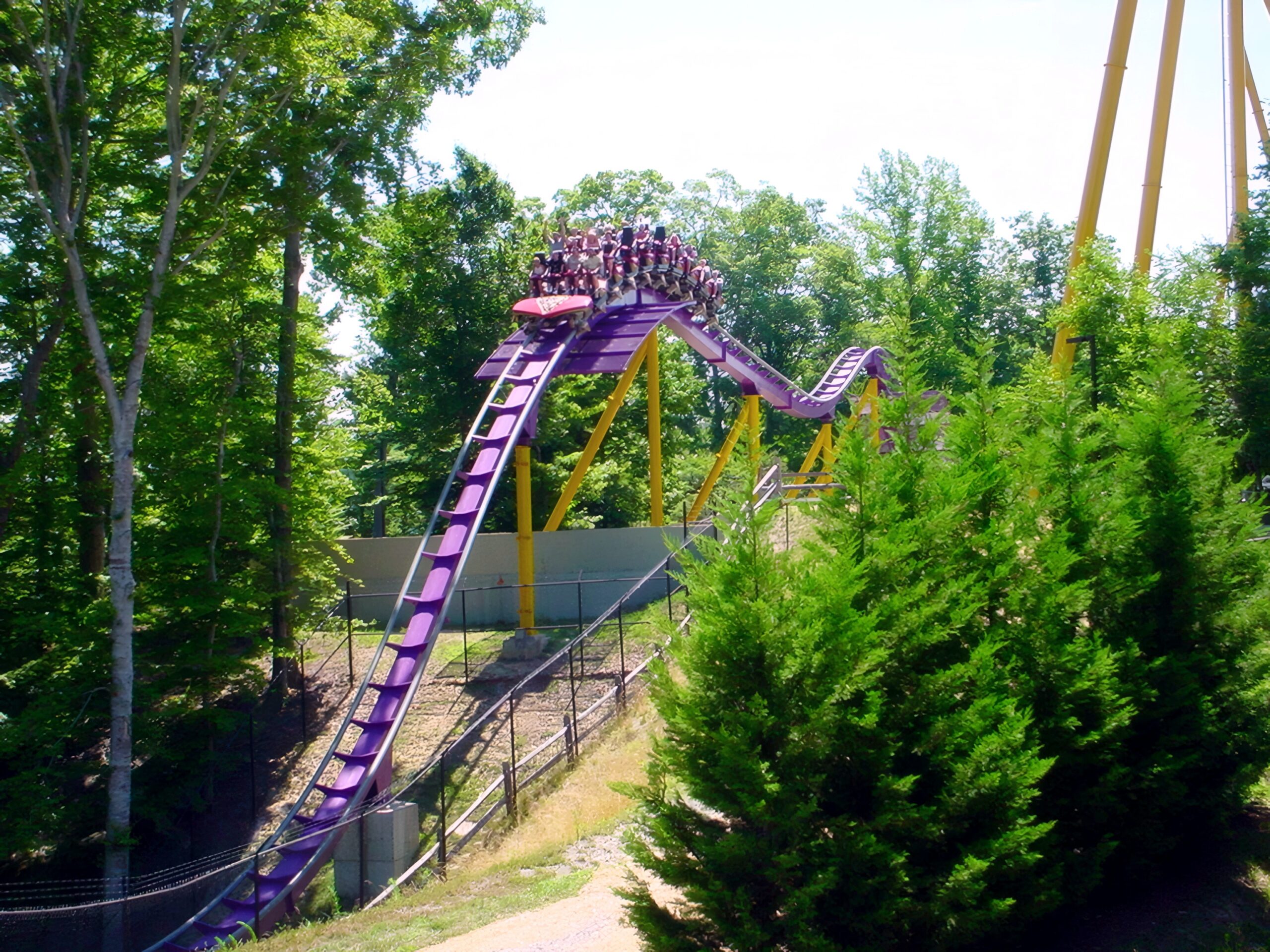 An Apollo's Chariot train cresting a hill above the trees, July 2001