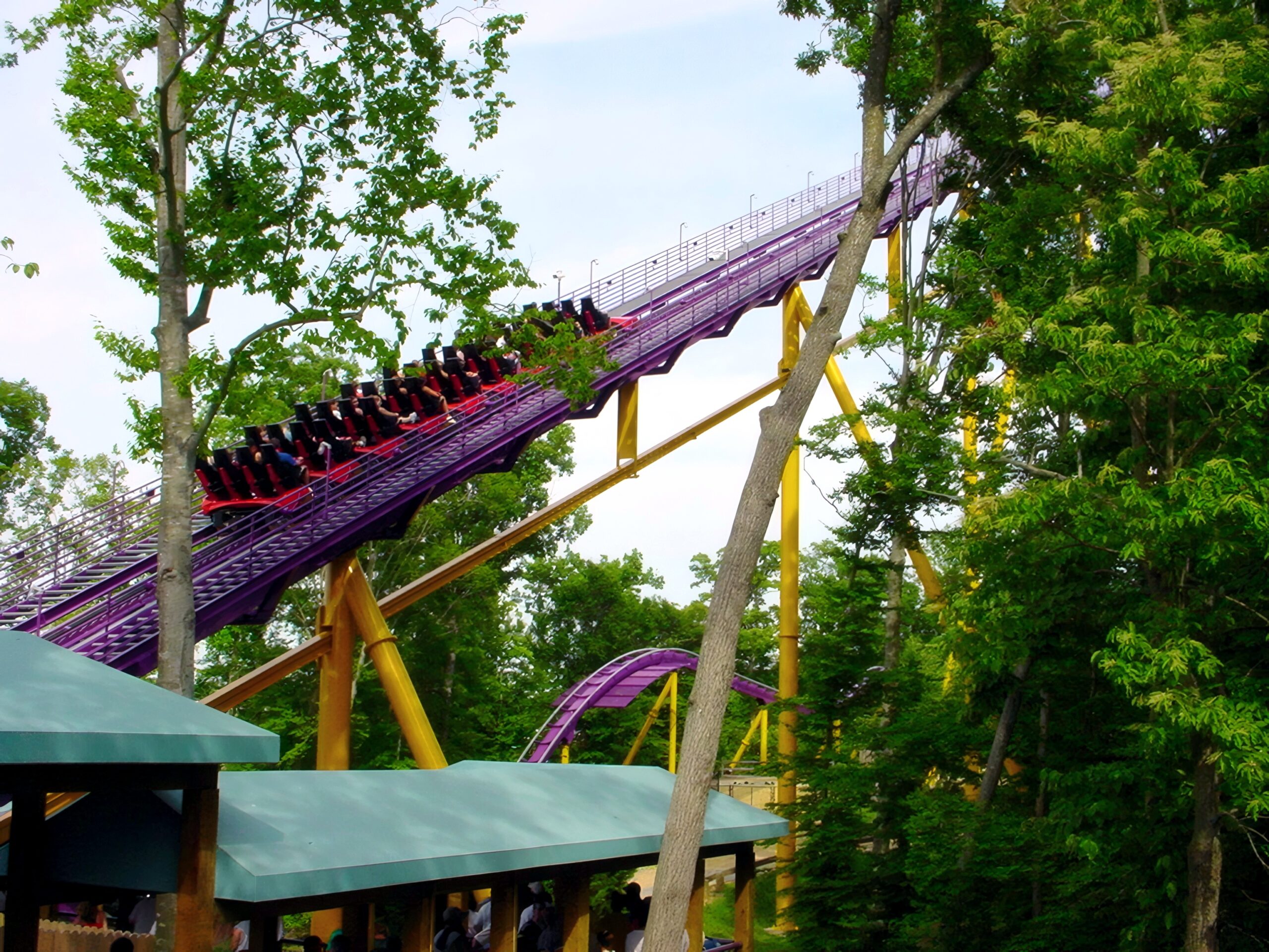 Riders on an Apollo's Chariot train climbing the lift hill, catwalk alongside, July 2001