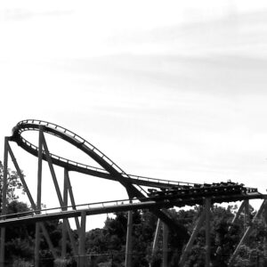 Apollo's Chariot's turnaround and a train on the track at Busch Gardens Williamsburg, in black and white