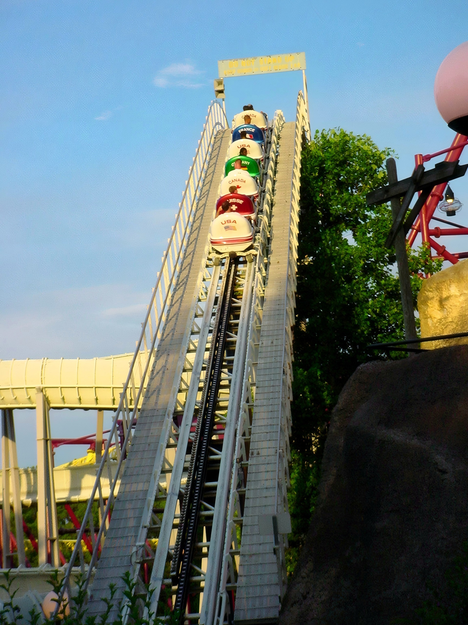 An Avalanche bobsled train climbing the lift hill at Paramount's Kings Dominion