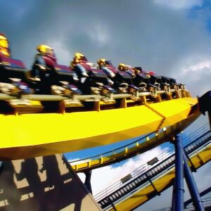 Batman Knight Flight (now Dominator) at Geauga Lake: riders zooming by on the yellow track, shot from the back row