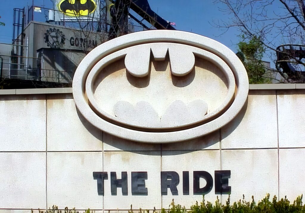 The Batman: The Ride entrance sign with the Gotham City station behind at Six Flags Great America, 2000