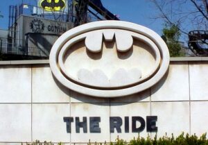 The Batman: The Ride entrance sign with the Gotham City station behind at Six Flags Great America, 2000