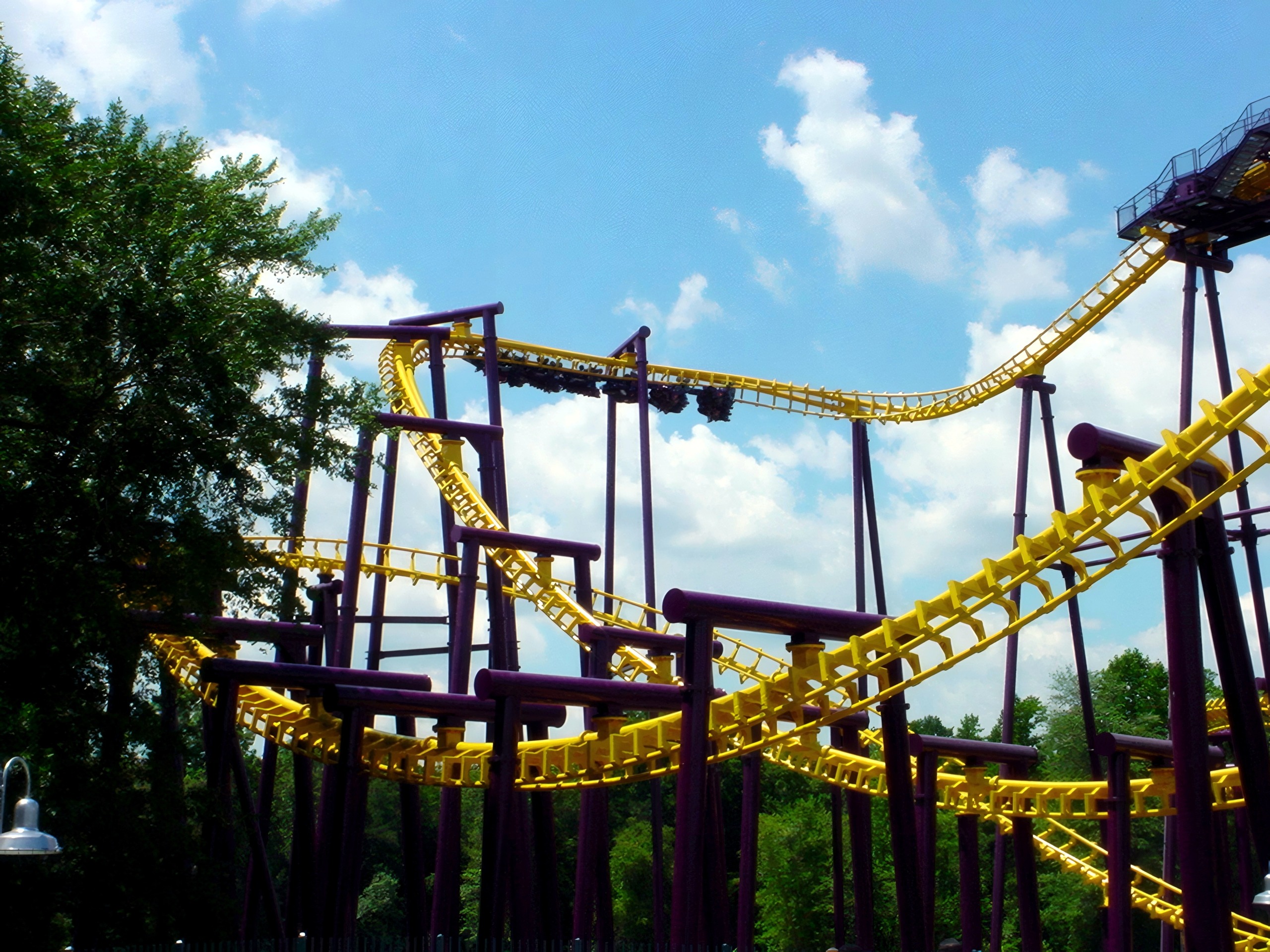 A Batwing train on the yellow track against the sky at Six Flags America, July 2001