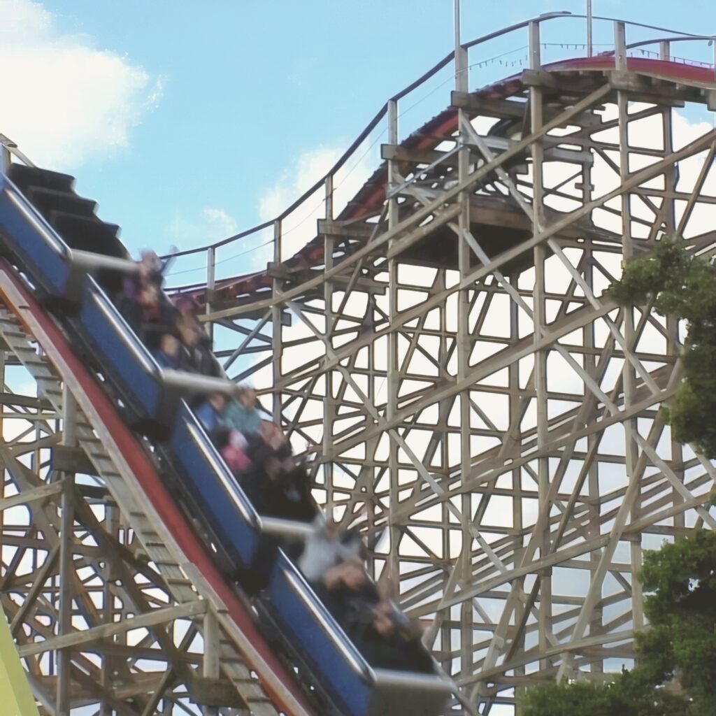 Big Dipper at Geauga Lake: a blue train coming down the drop of the 1925 wooden coaster