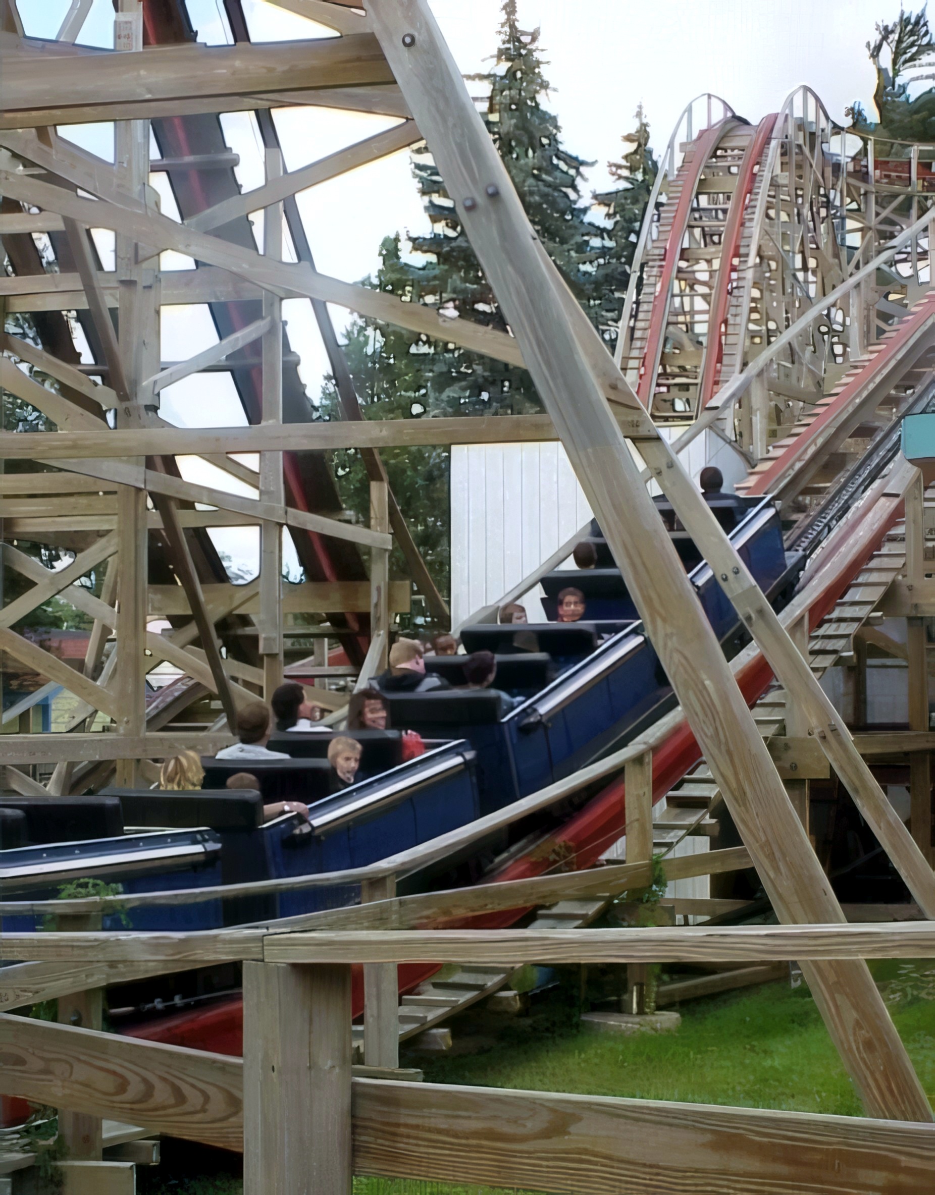 Riders on a Big Dipper train heading down a hill at Geauga Lake, May 2000