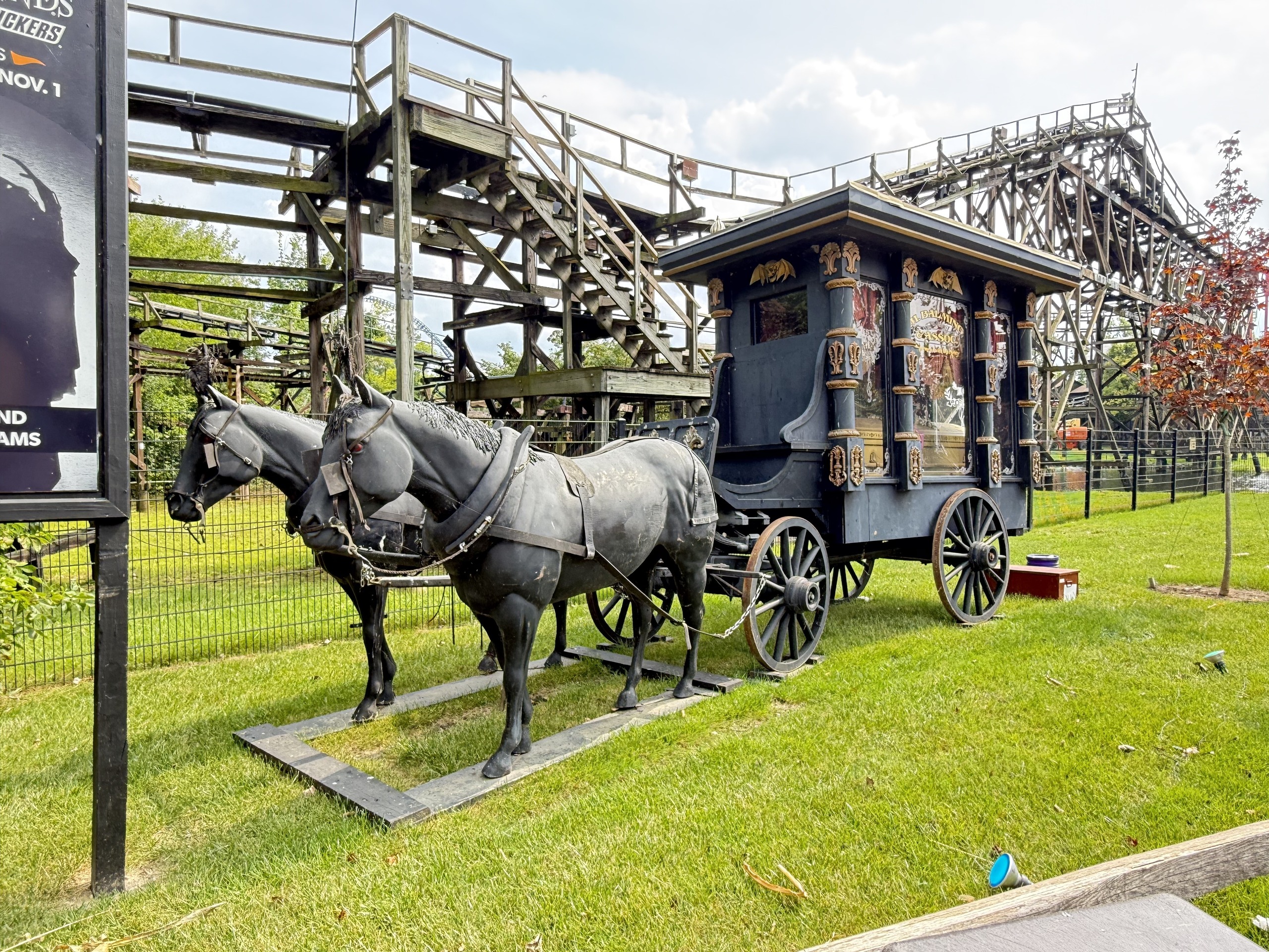 The HalloWeekends hearse and horse statues in front of Cedar Creek Mine Ride's trestle and lift