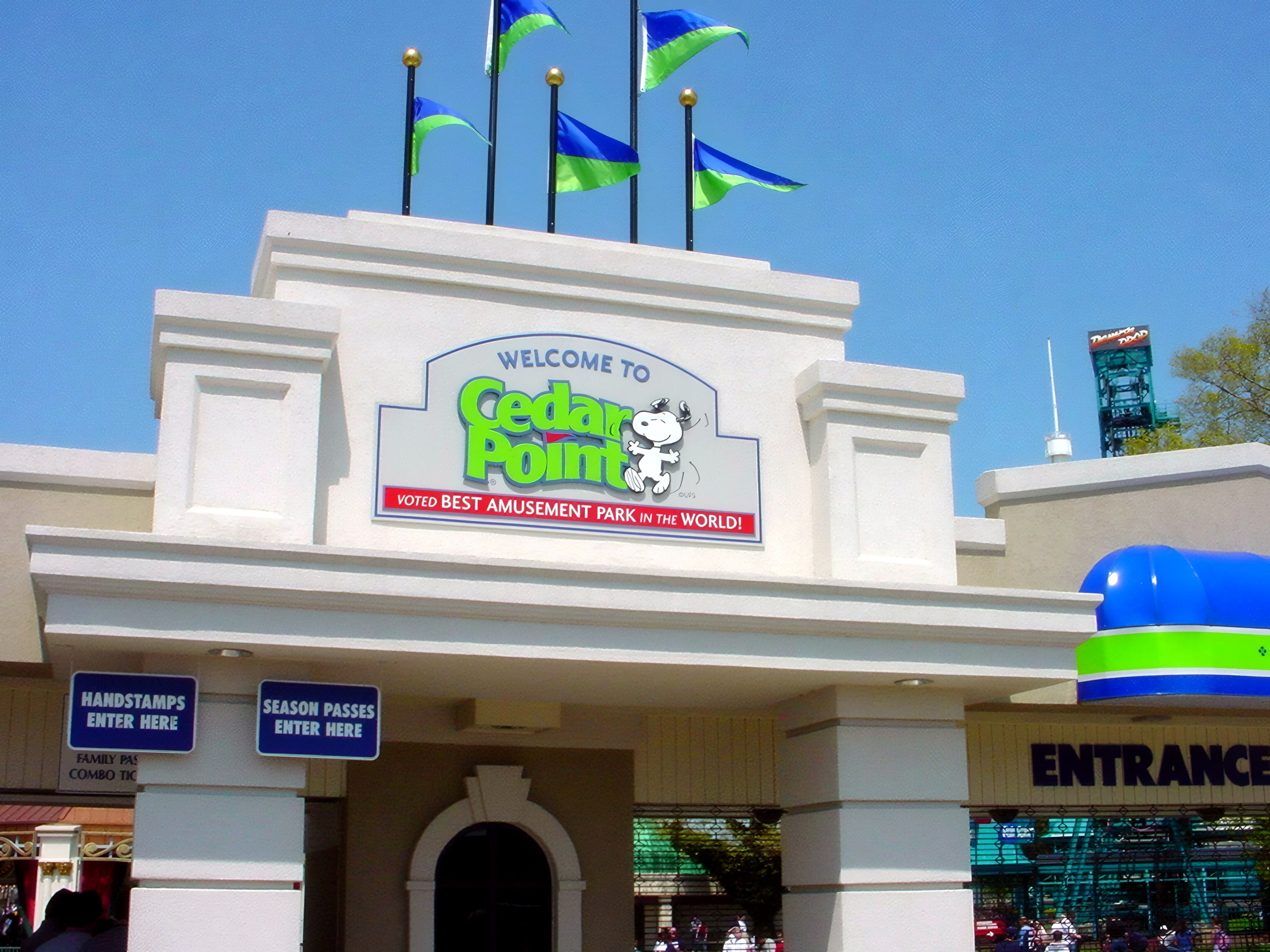 The Welcome to Cedar Point main entrance sign with flags at Cedar Point, May 2002