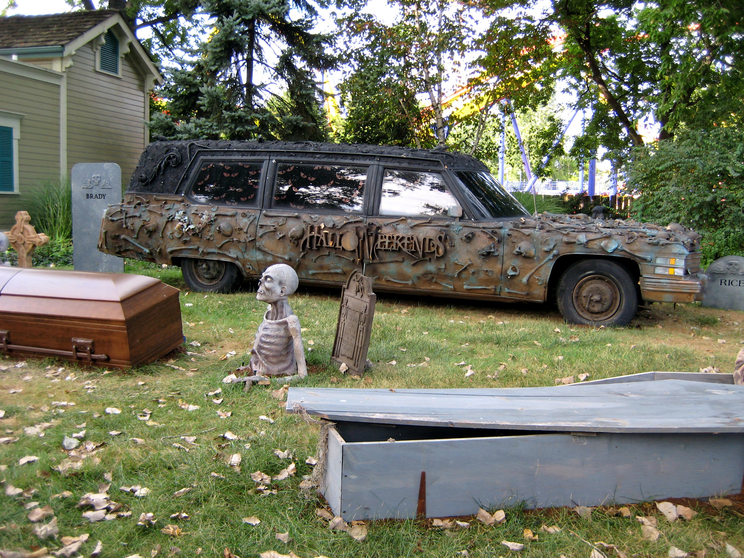A HalloWeekends hearse with coffins, tombstones and a skeleton on the lawn at Cedar Point, September 2007
