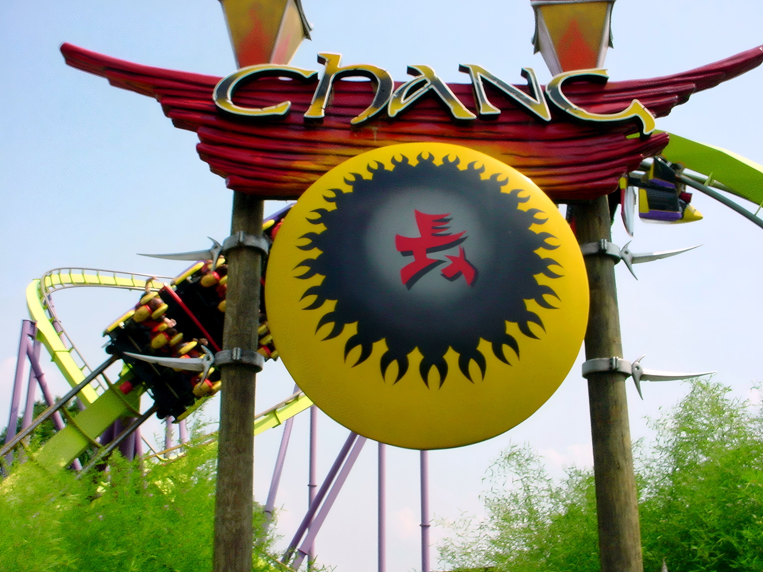 Close-up of Chang ride sign with train and riders, Chang, July 2002