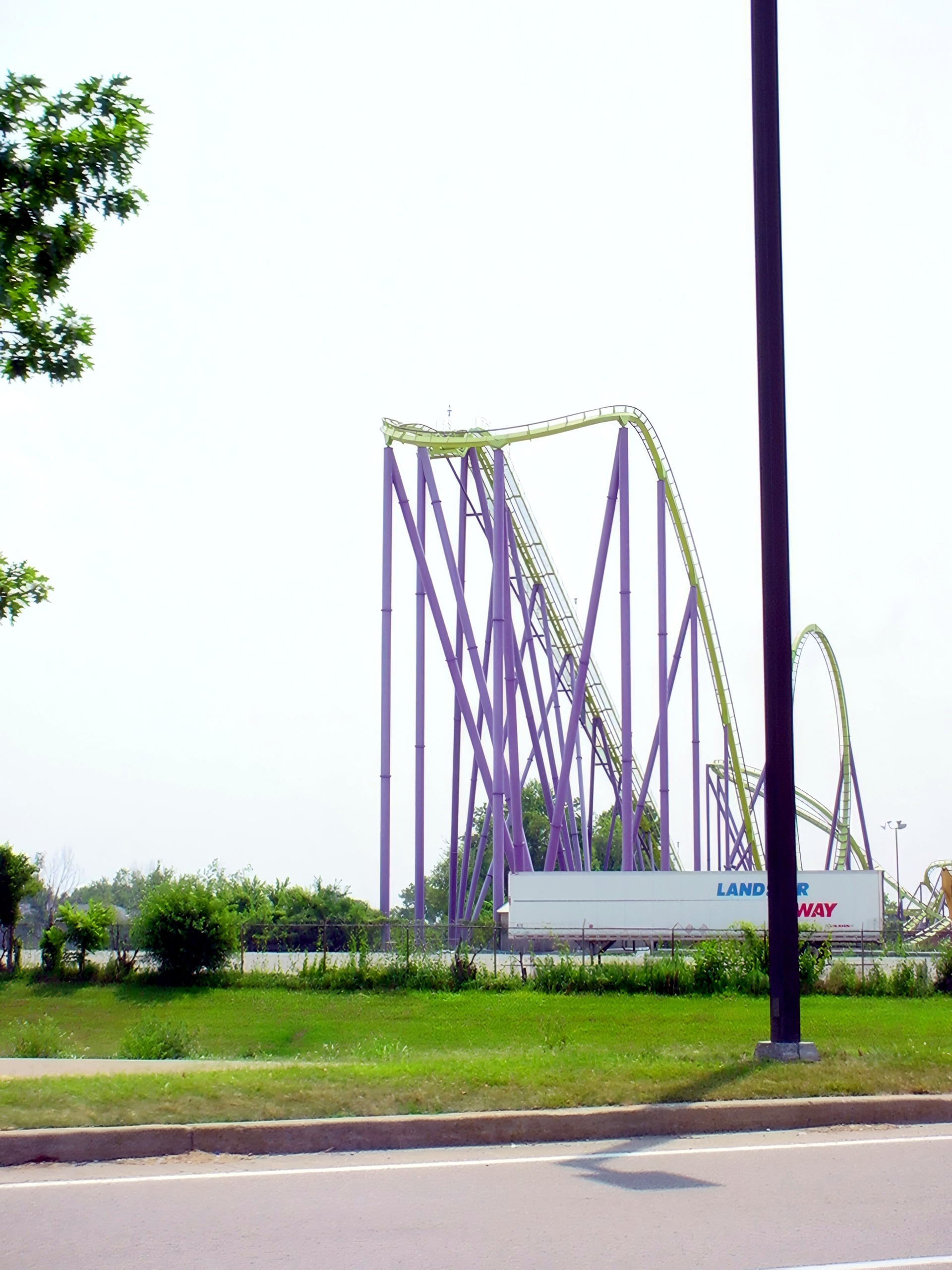 Coaster lift hill with purple supports, hazy overexposed sky, Chang, July 2002
