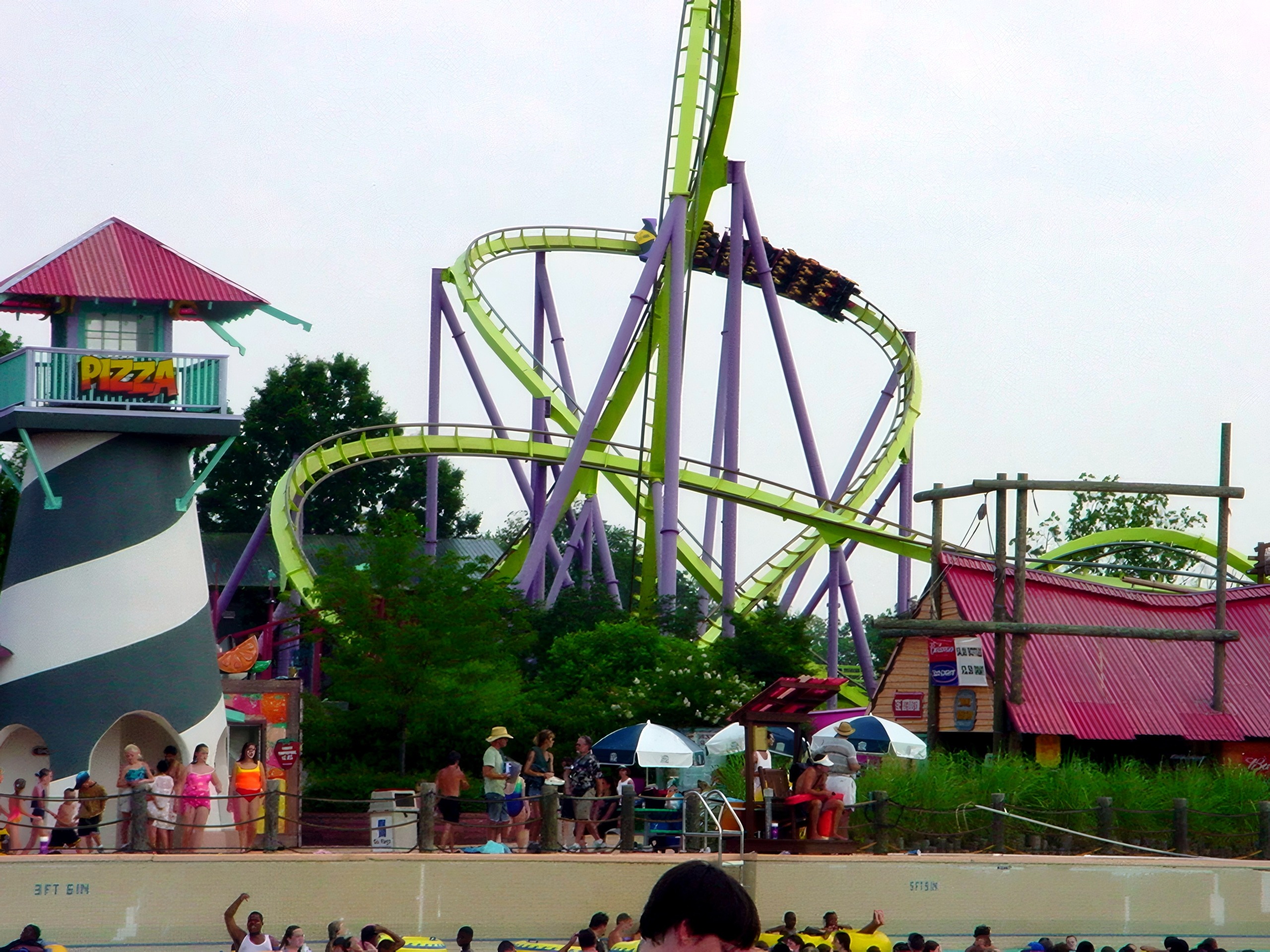 Coaster loops behind striped lighthouse tower and pizza stand, Chang, July 2002
