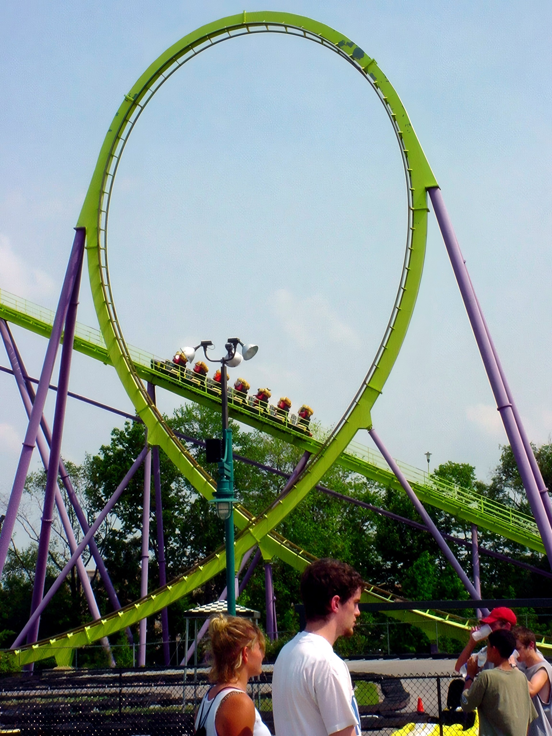 Green loop track with spectators watching through chain-link fence, Chang, July 2002