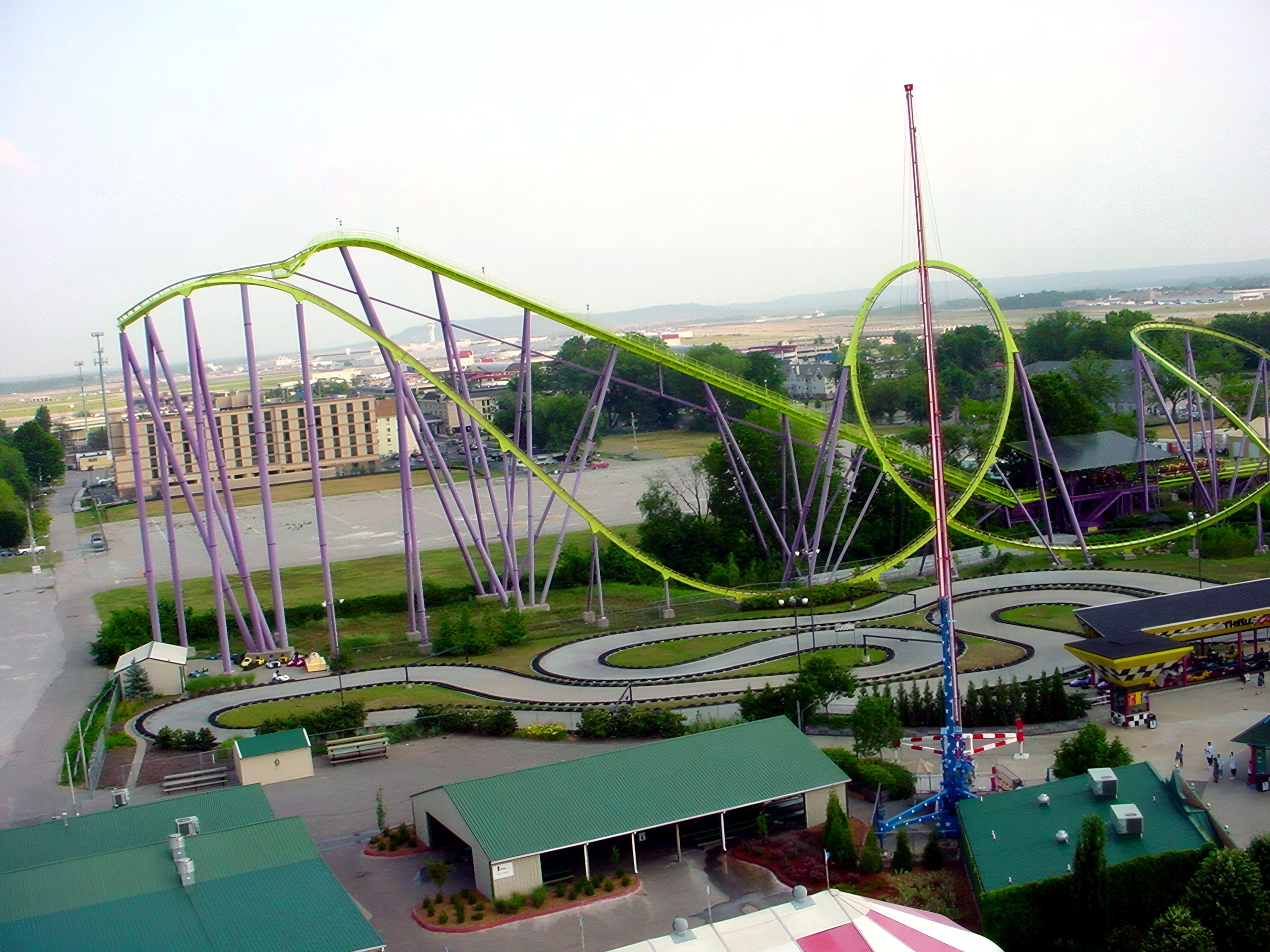 Green looping coaster above go-kart track and walkways, Chang, July 2002