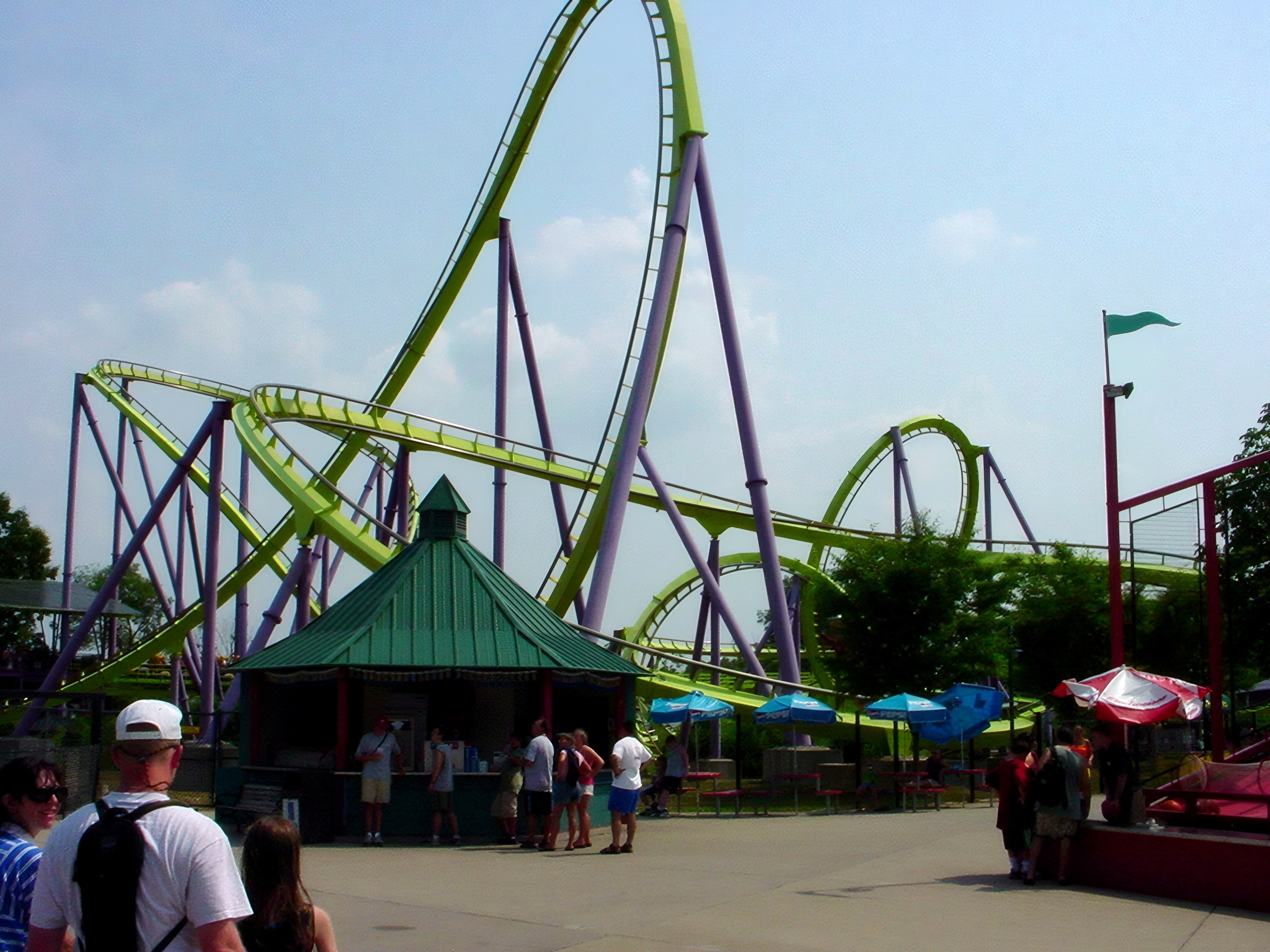 Green looping coaster track over plaza and kiosk, Chang, July 2002