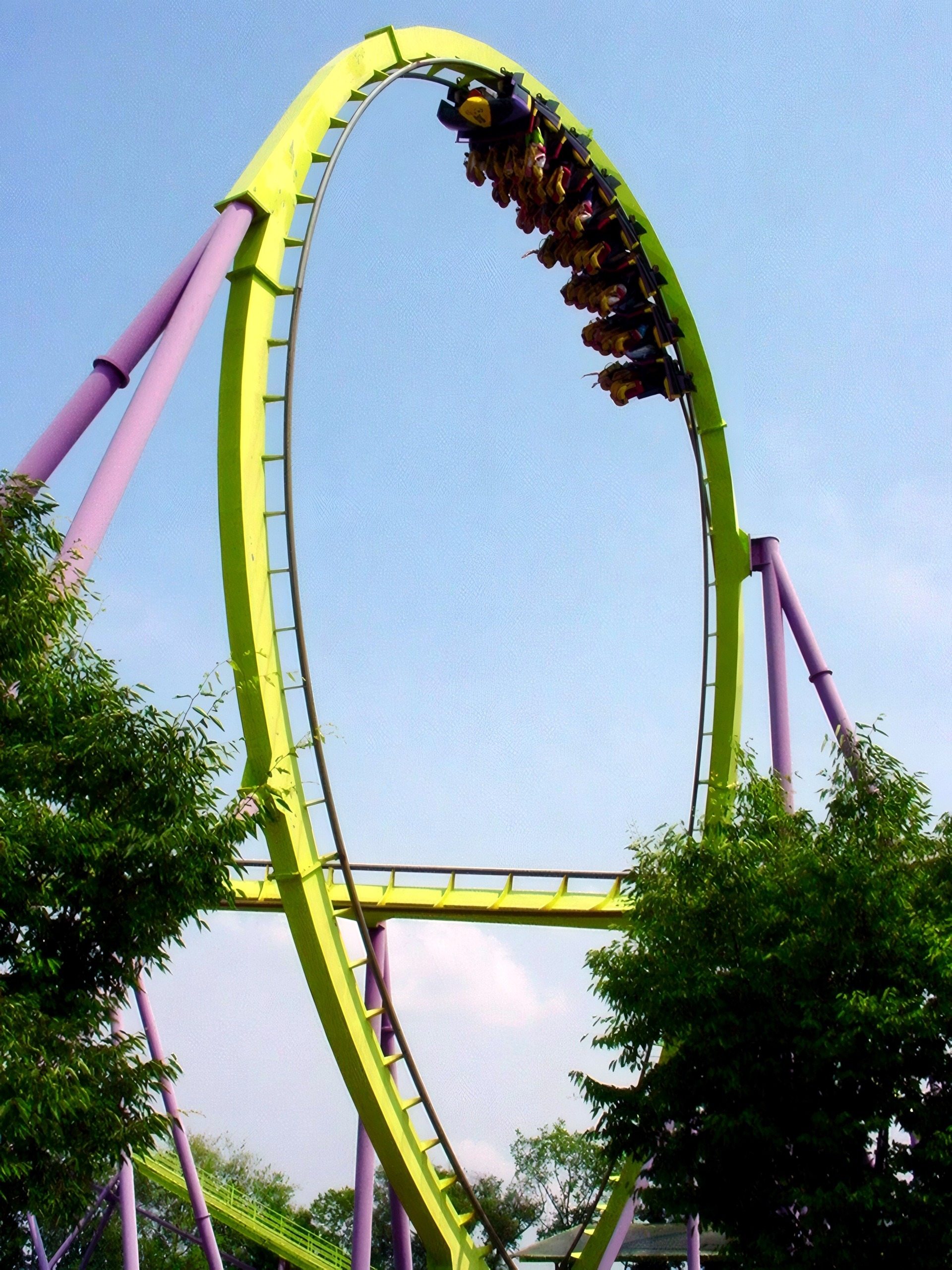 Inverted train banking through vertical loop against blue sky, Chang, July 2002