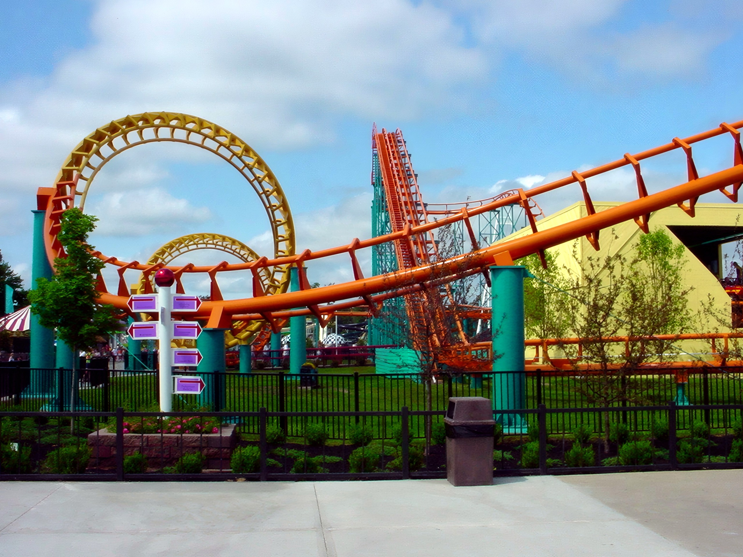 The vertical loop's orange track and yellow supports, Corkscrew, June 2002