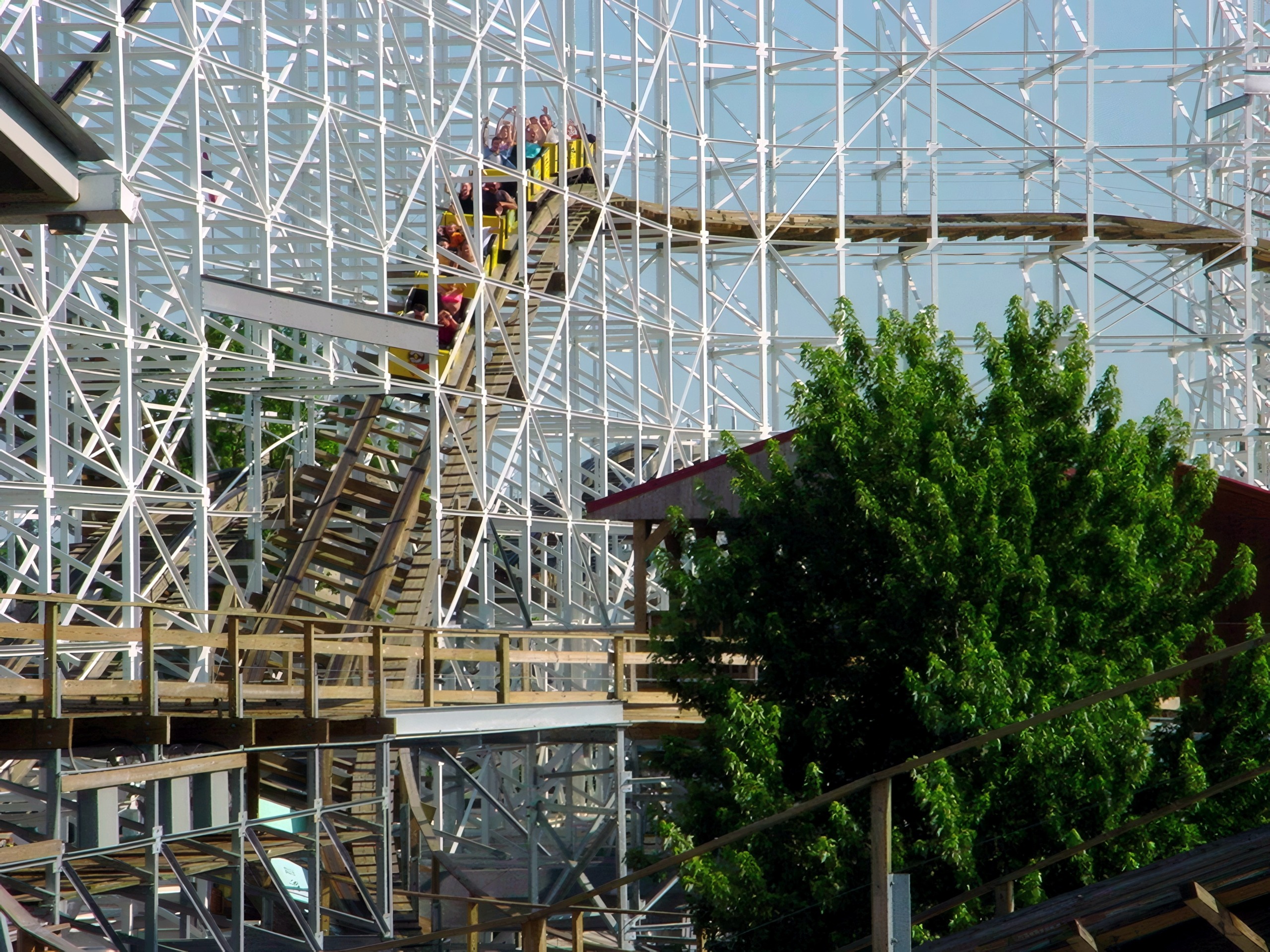 A Cornball Express train full of riders cresting a hill, June 2002