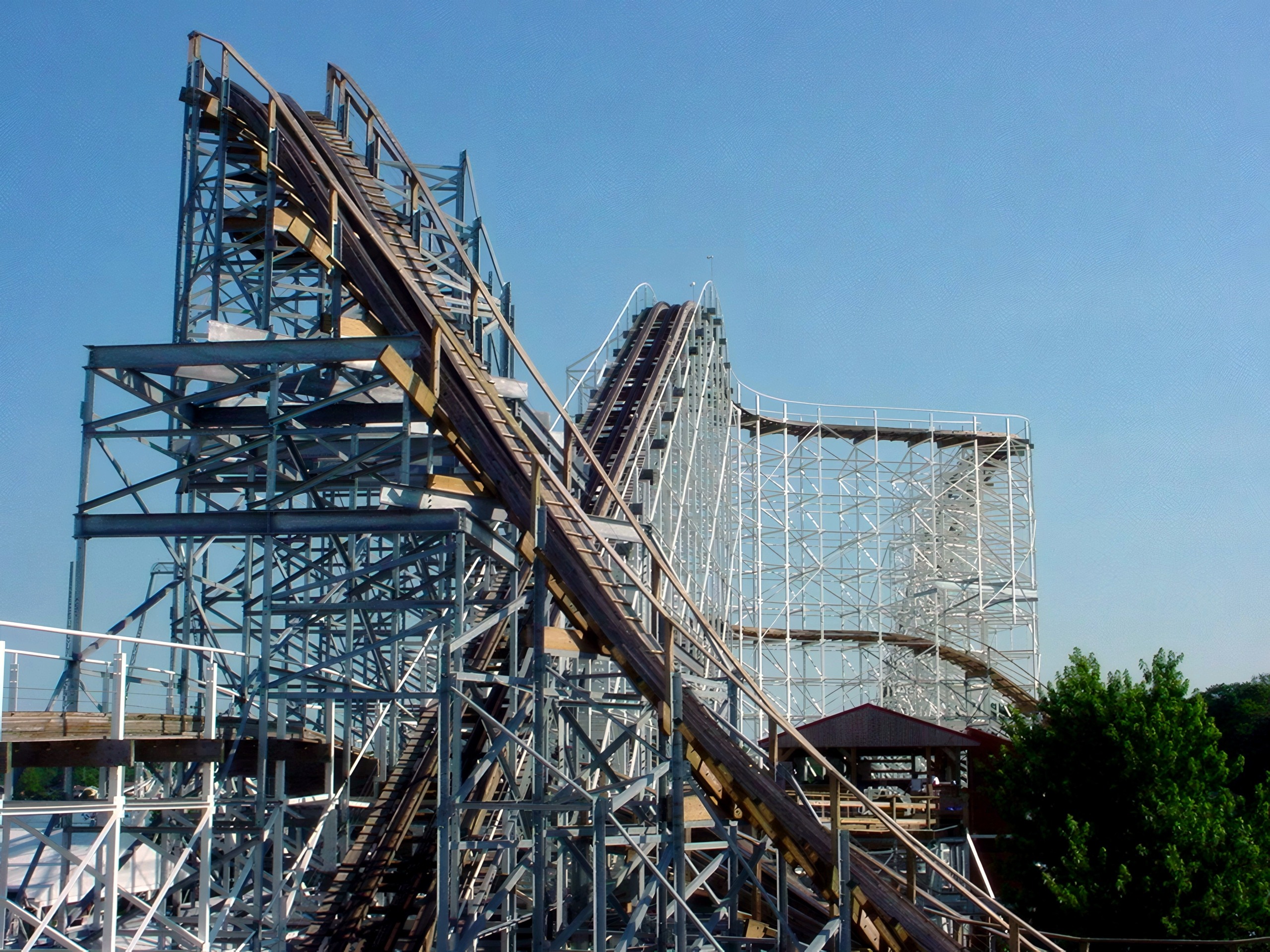 Cornball Express's wooden track threading through white steel supports, June 2002