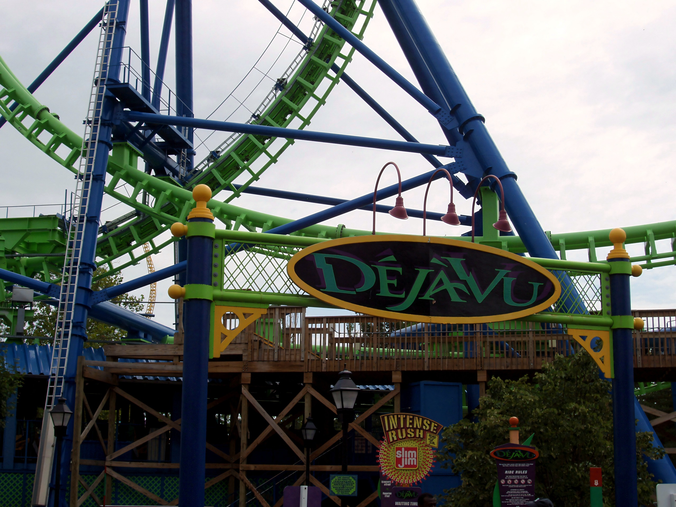 The Déjà Vu sign framed by the green track and blue supports at Six Flags Great America, August 2005
