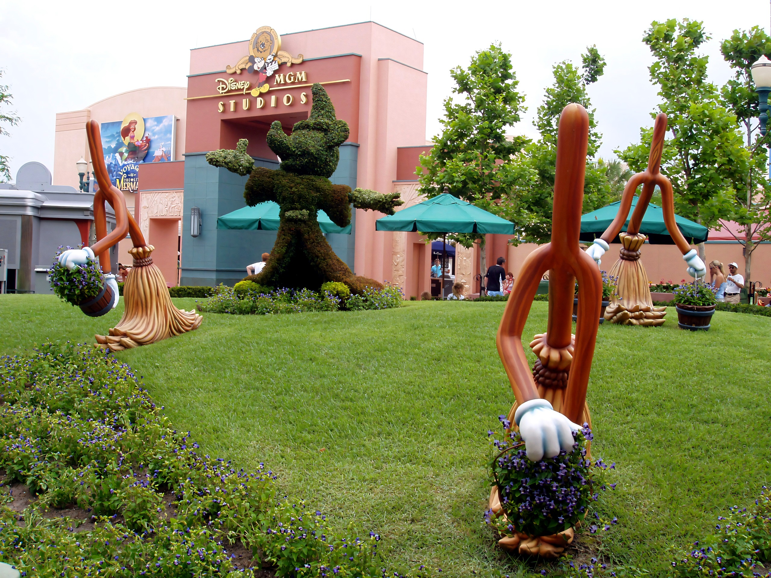 Fantasia broom topiary with Disney-MGM Studios entrance sign visible, Disney's Hollywood Studios, June 2006