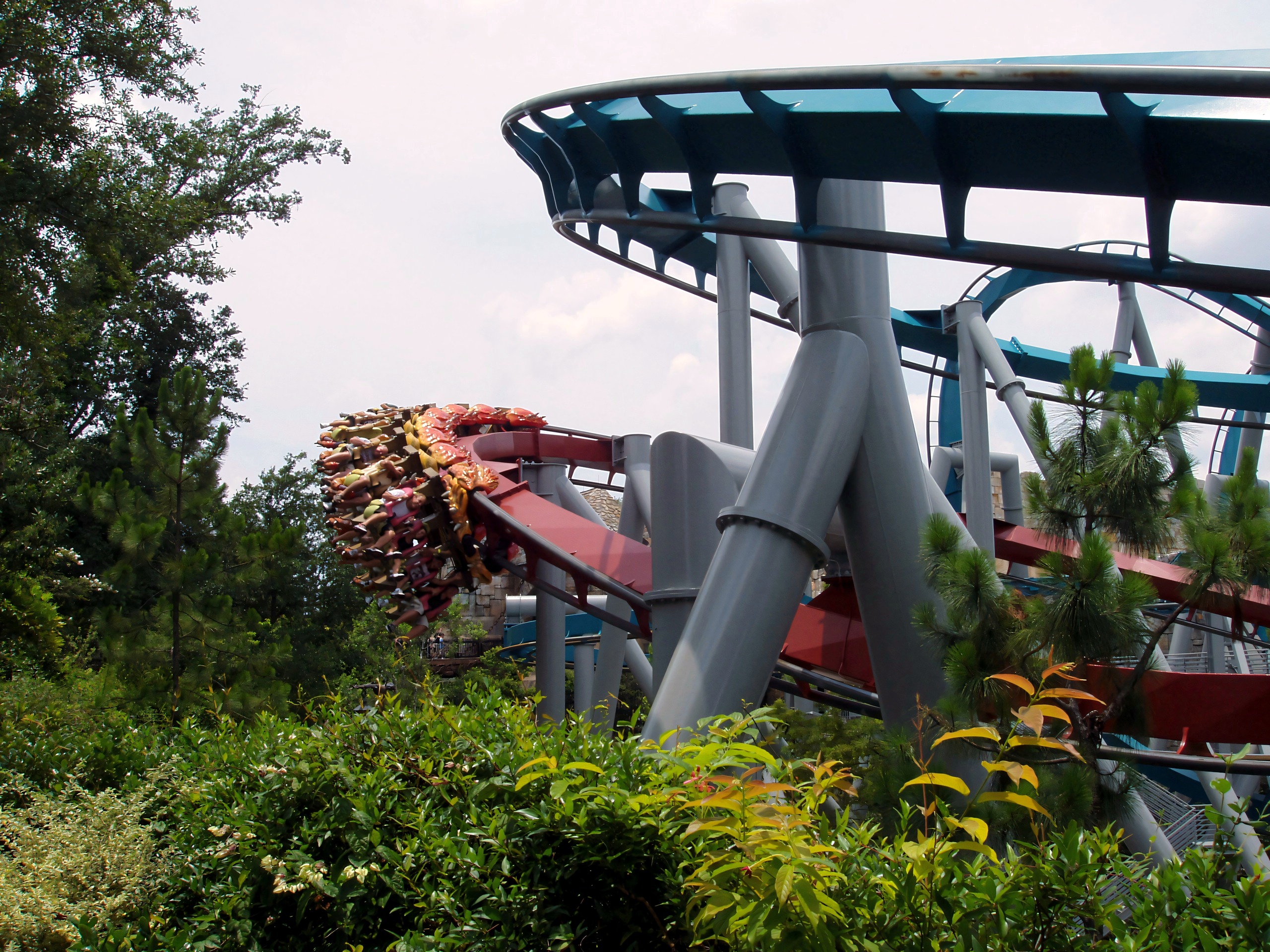 Train cresting a hill beside the dragon statue, Dueling Dragons, July 2006