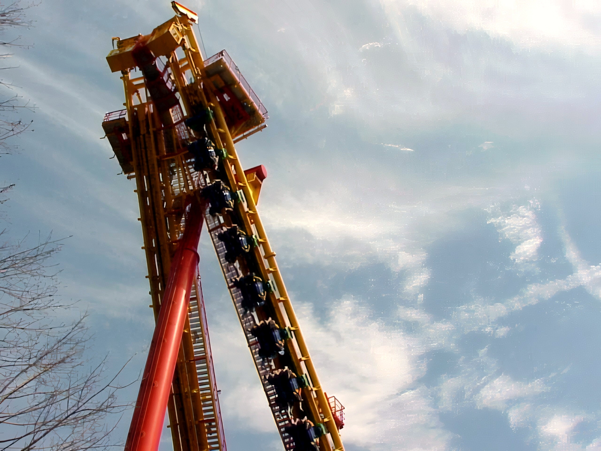 A Face/Off train climbing the spike with riders face to face at Kings Island, April 2001