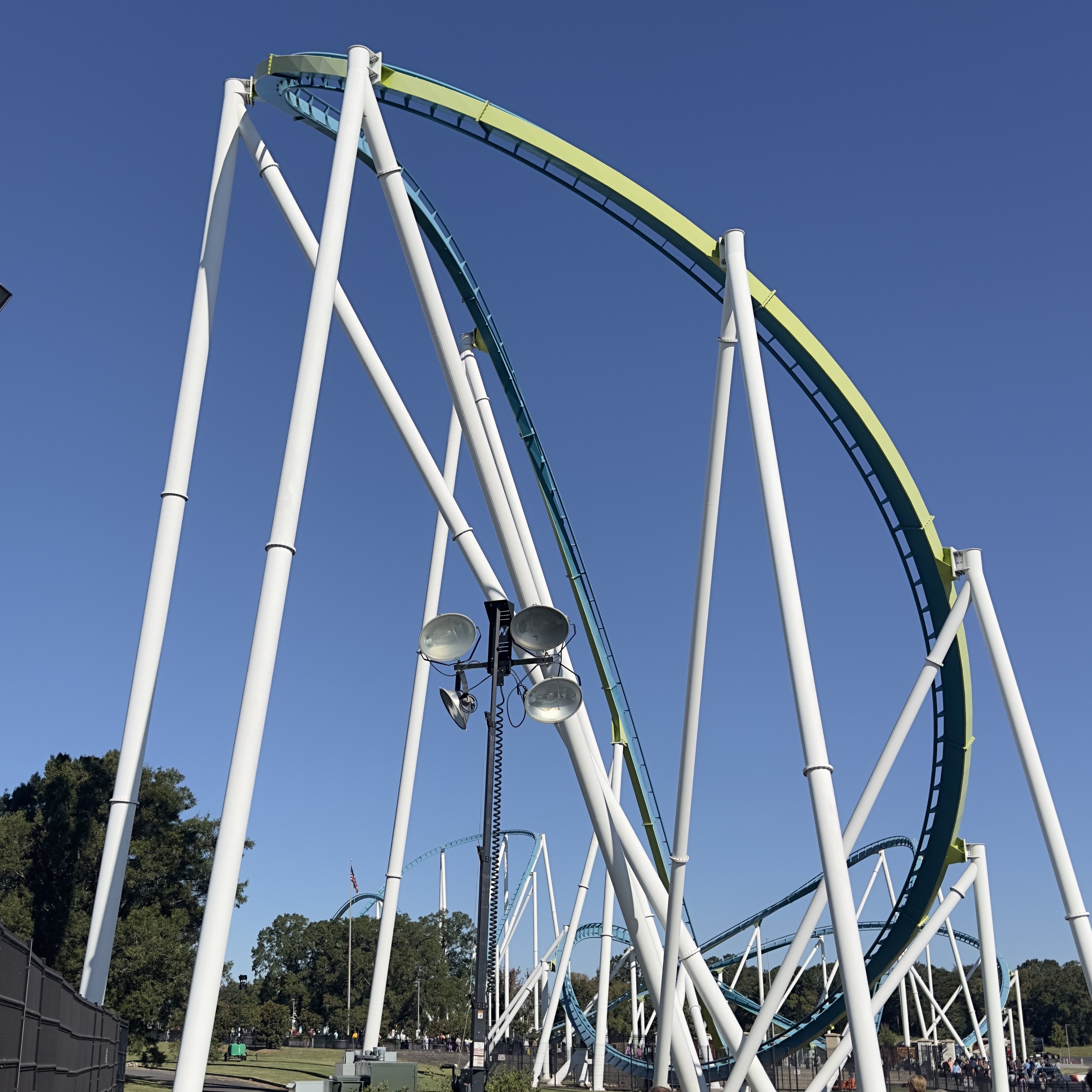 Fury 325's white supports and teal track curving away from the 320-foot drop, Carowinds, October 2024