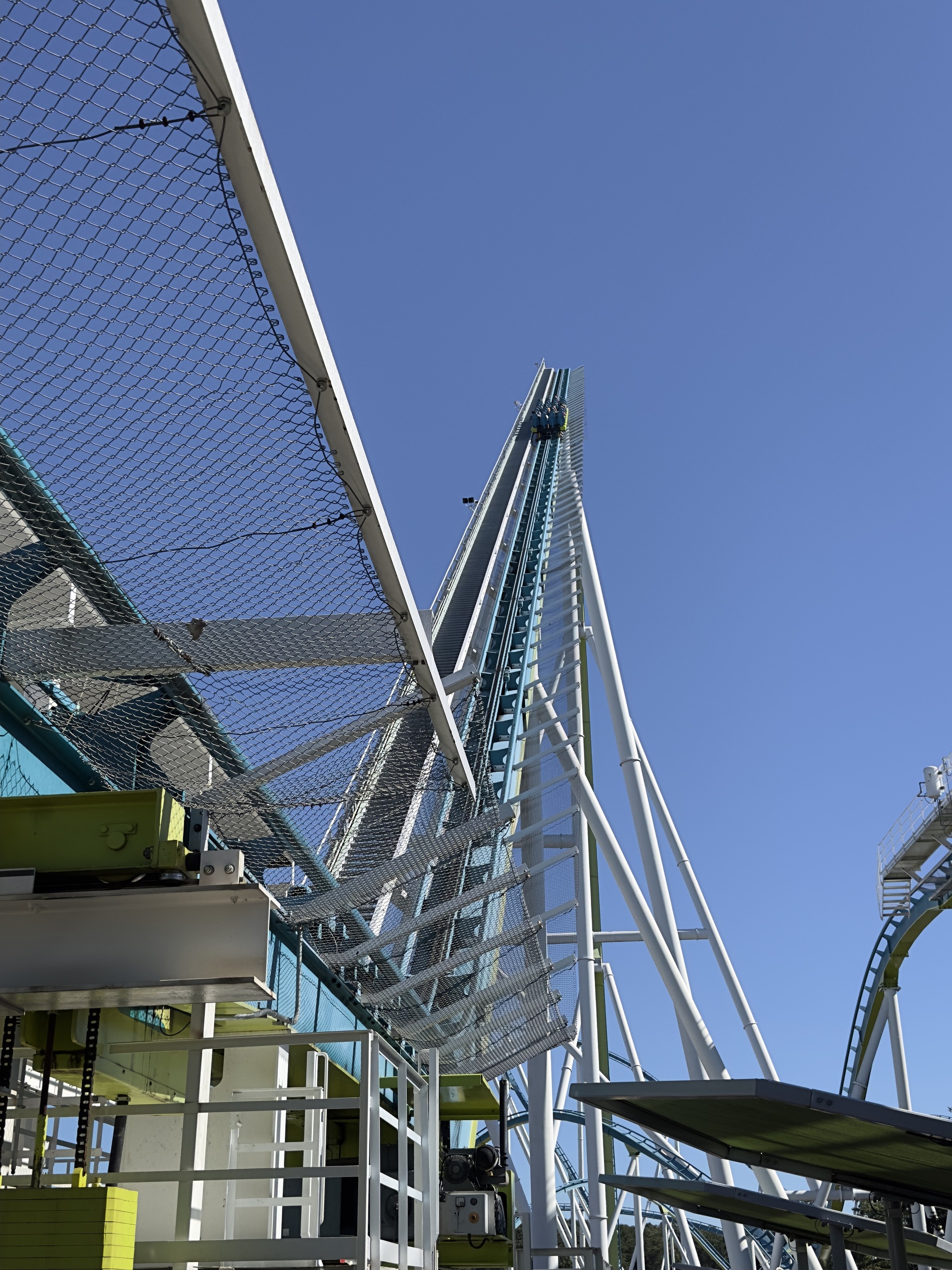 Fury 325's lift hill seen through the queue walkway netting, Carowinds, October 2024