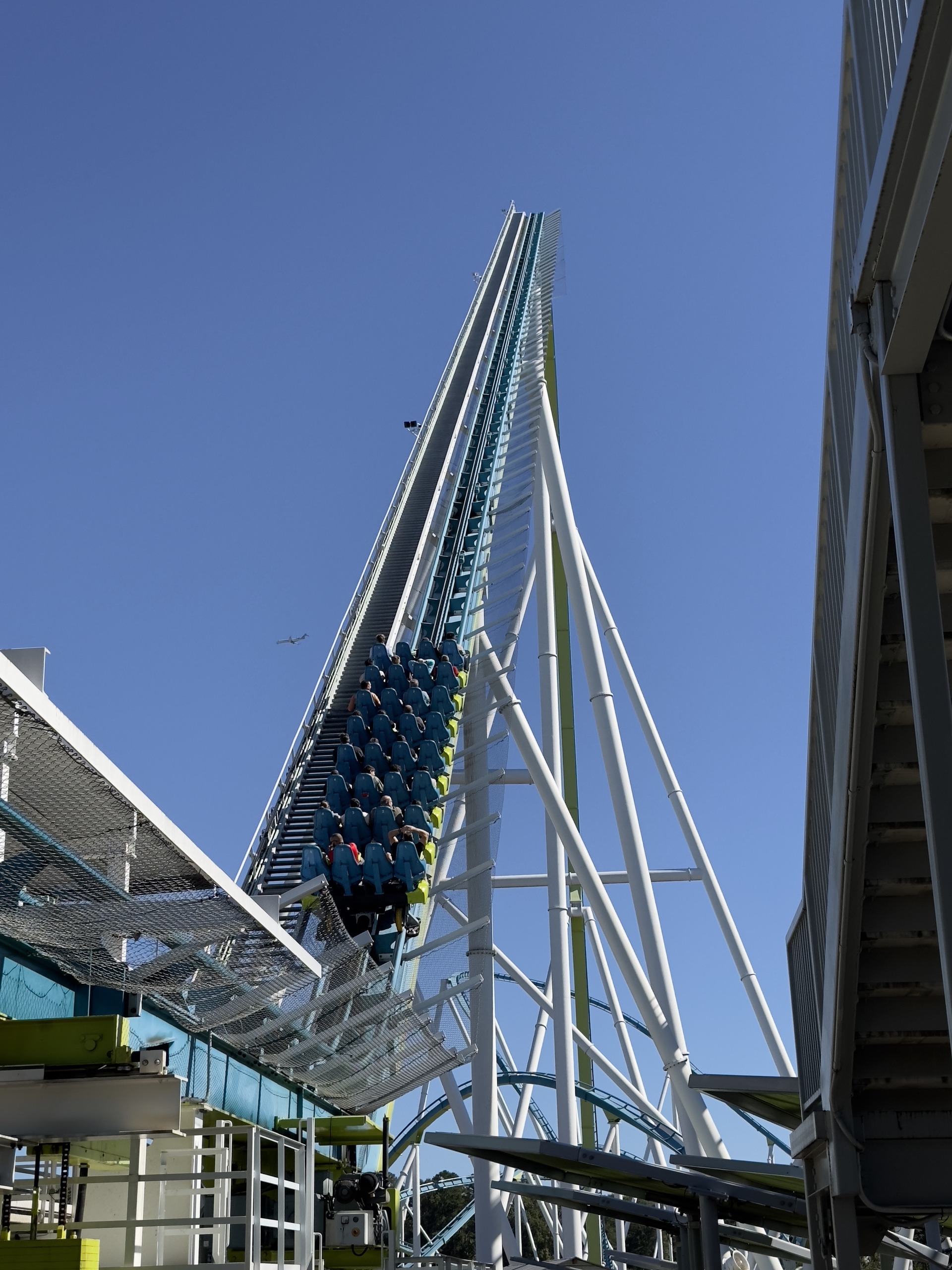 A loaded Fury 325 train on the lift hill above the station, Carowinds, October 2024
