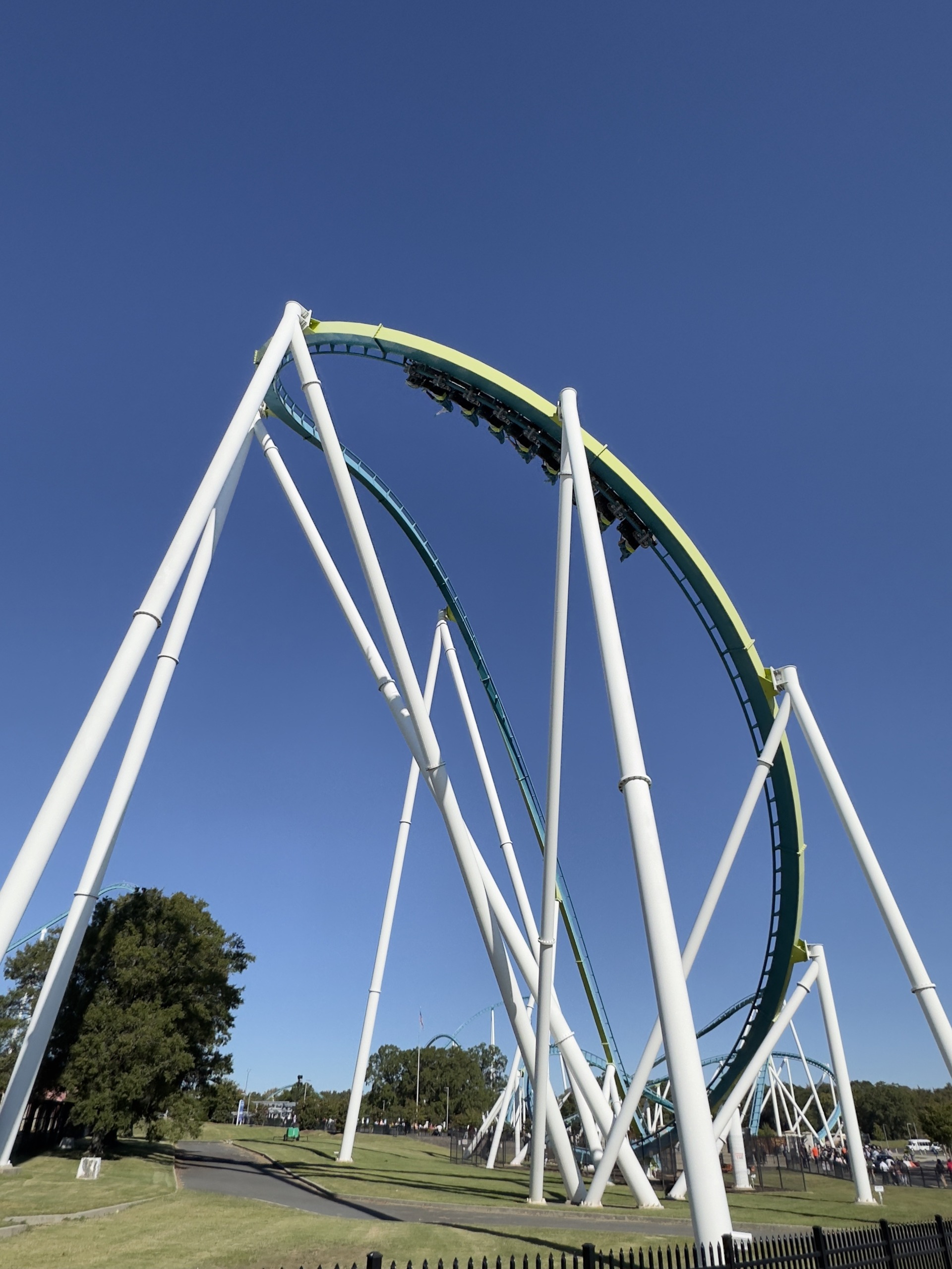 A Fury 325 train coming off the drop into the banked curve, Carowinds, October 2024