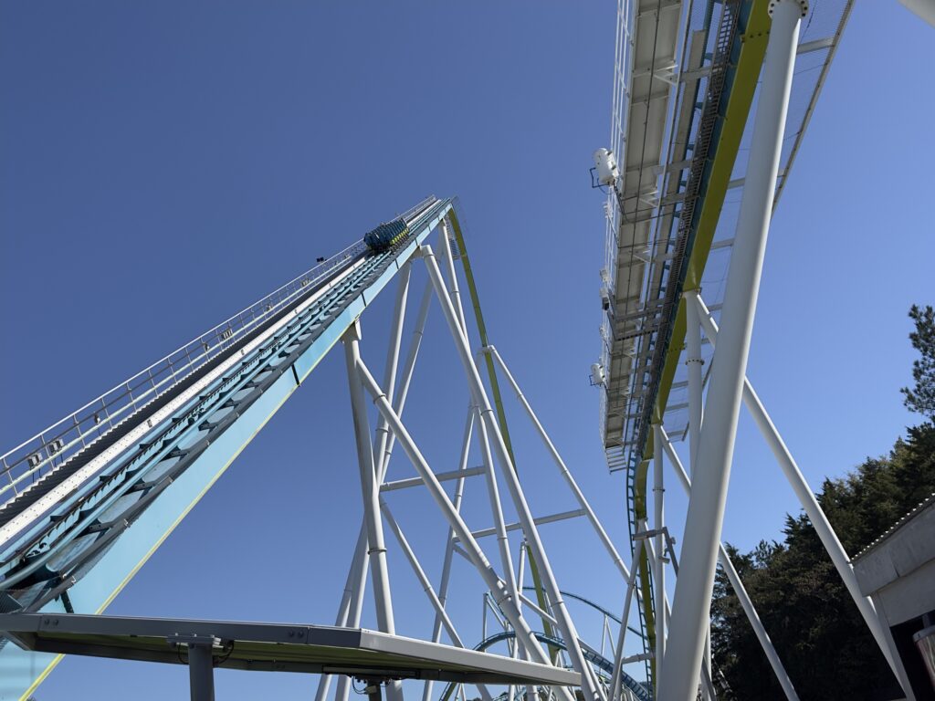 A Fury 325 train high on the lift hill with the return track overhead, Carowinds, October 2024