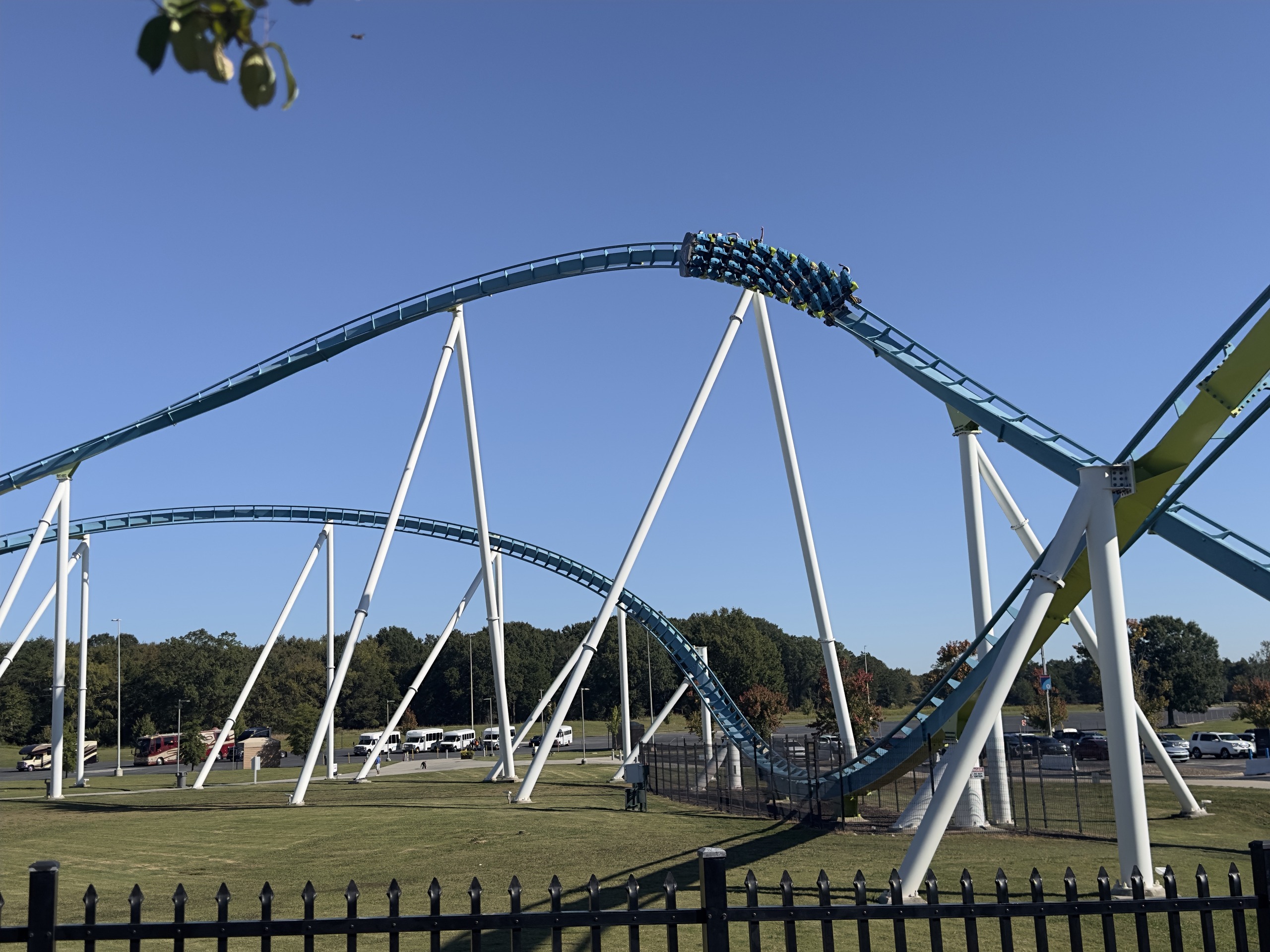 A Fury 325 train on top of an airtime hill beside a yellow-green support, Carowinds, October 2024