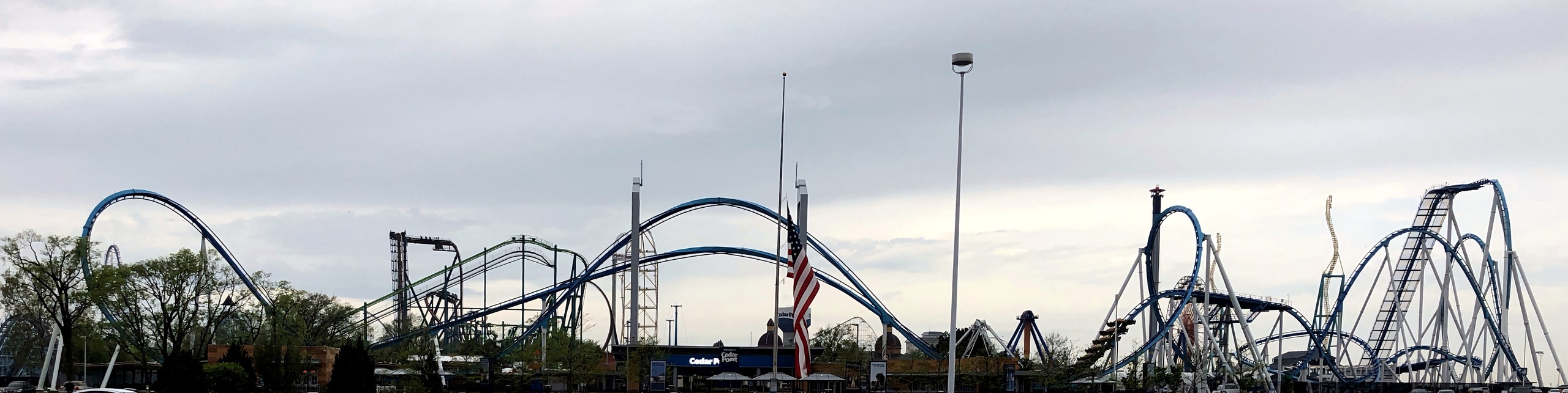 Cedar Point skyline with coasters, flags, from parking lot, GateKeeper, May 2018