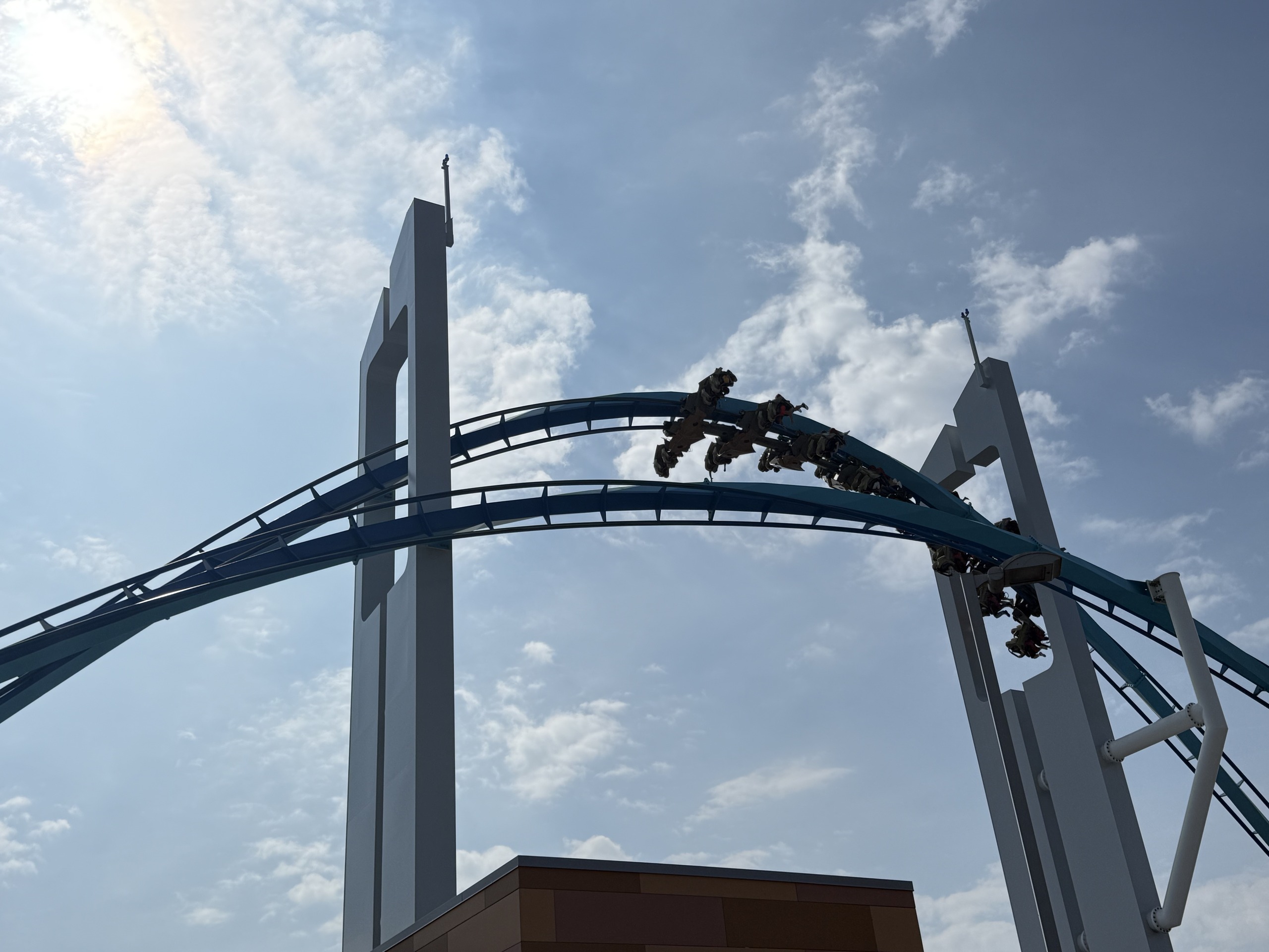 A GateKeeper train exiting the keyhole tower with teal track and gray supports