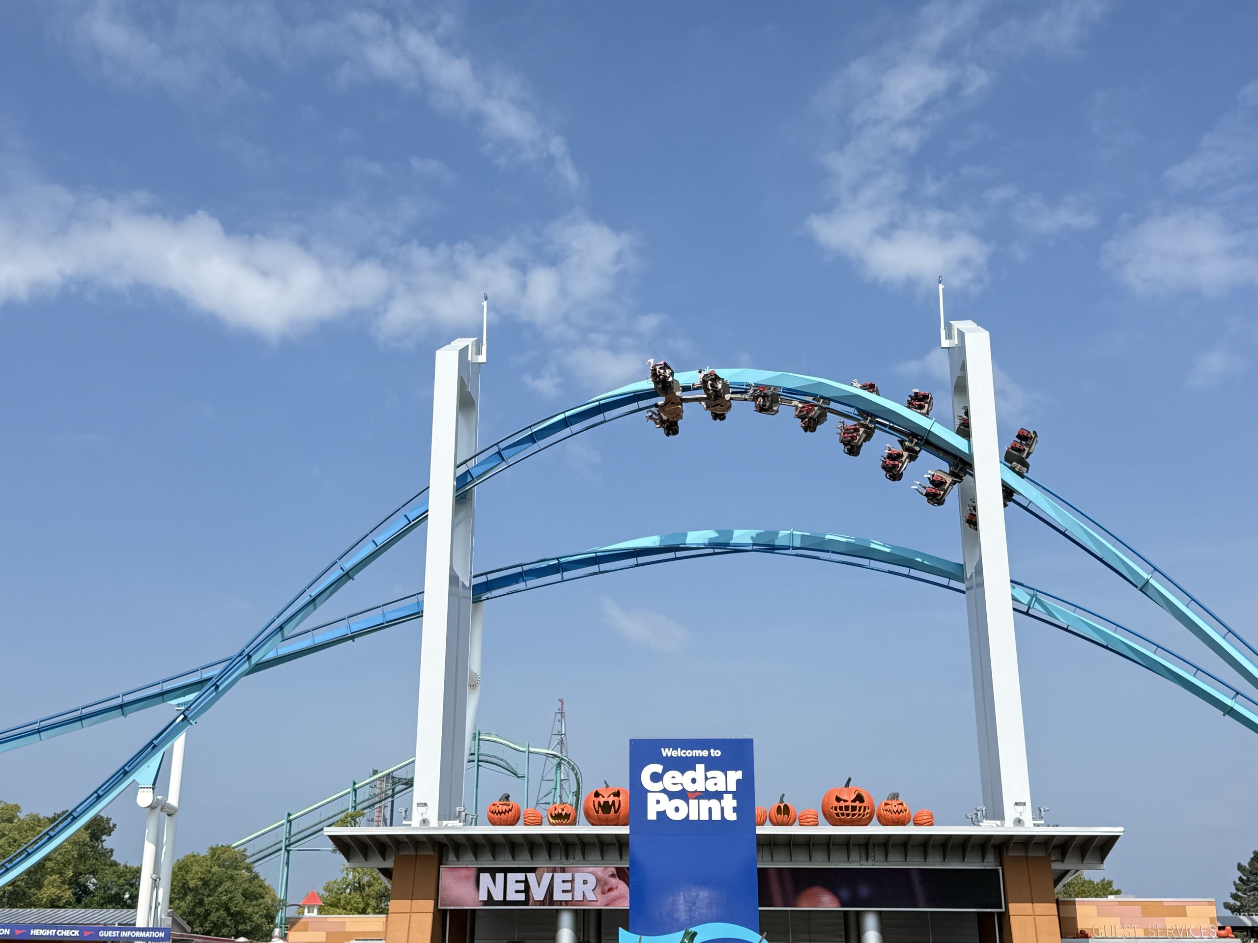 A GateKeeper train inverted at the top of the keyhole element above the Cedar Point entrance