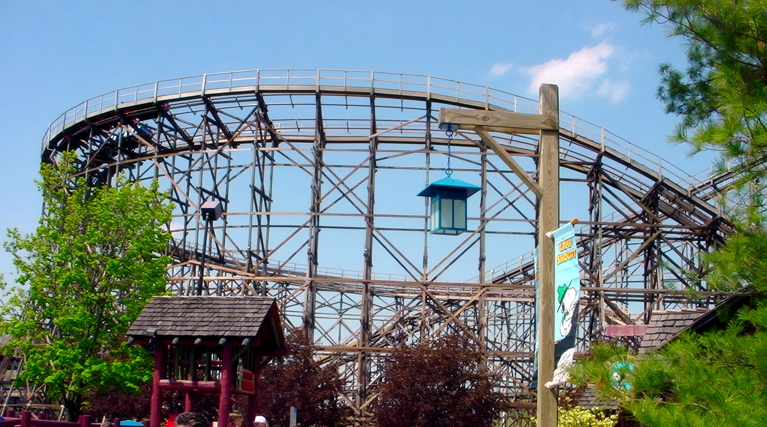 Gemini's curving wooden structure rising over the midway at Cedar Point, May 2002