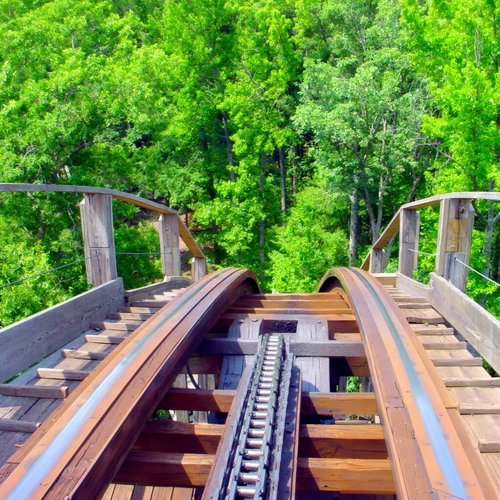 Grizzly at Kings Dominion: the wooden track cresting a hill into the trees, seen from the front seat