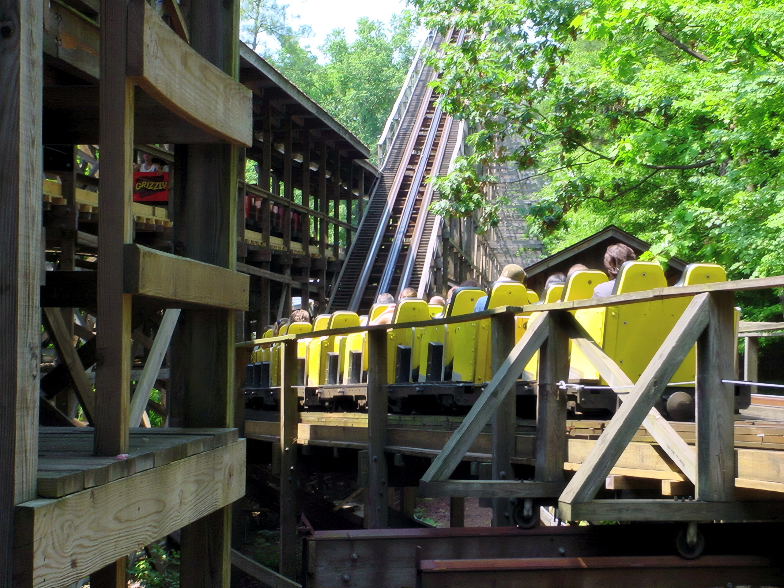 A yellow Grizzly train leaving the station at Kings Dominion, July 2001
