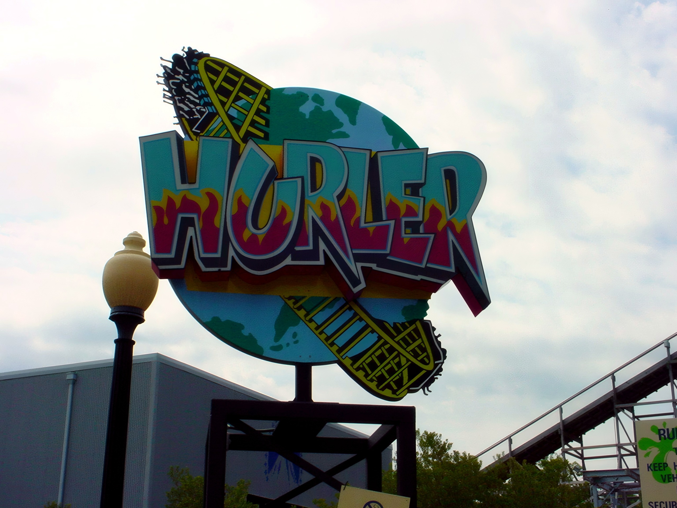 The Hurler entrance sign with its globe logo at Kings Dominion, July 2001