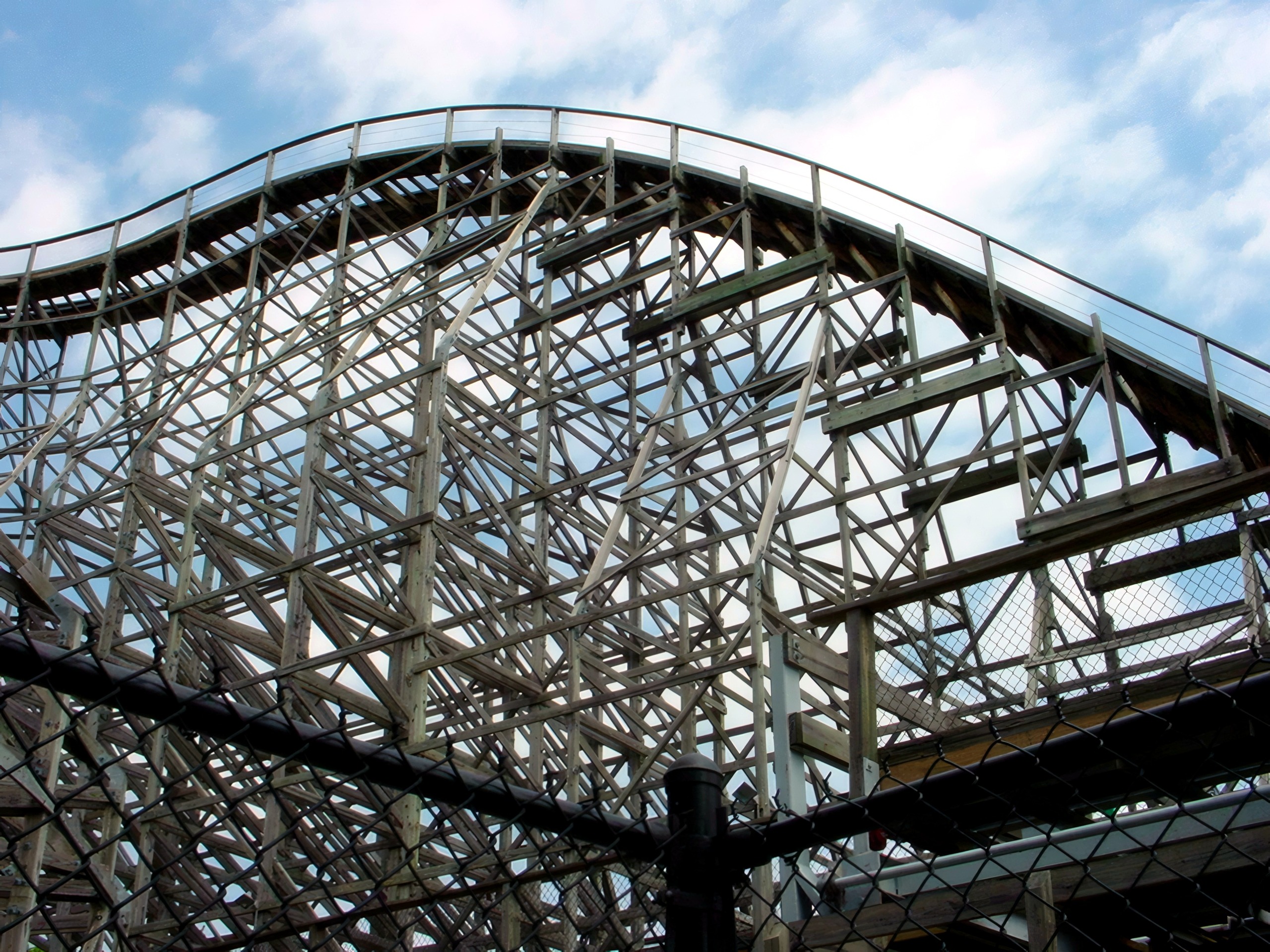 The Hurler wooden structure and track against the sky at Kings Dominion, July 2001
