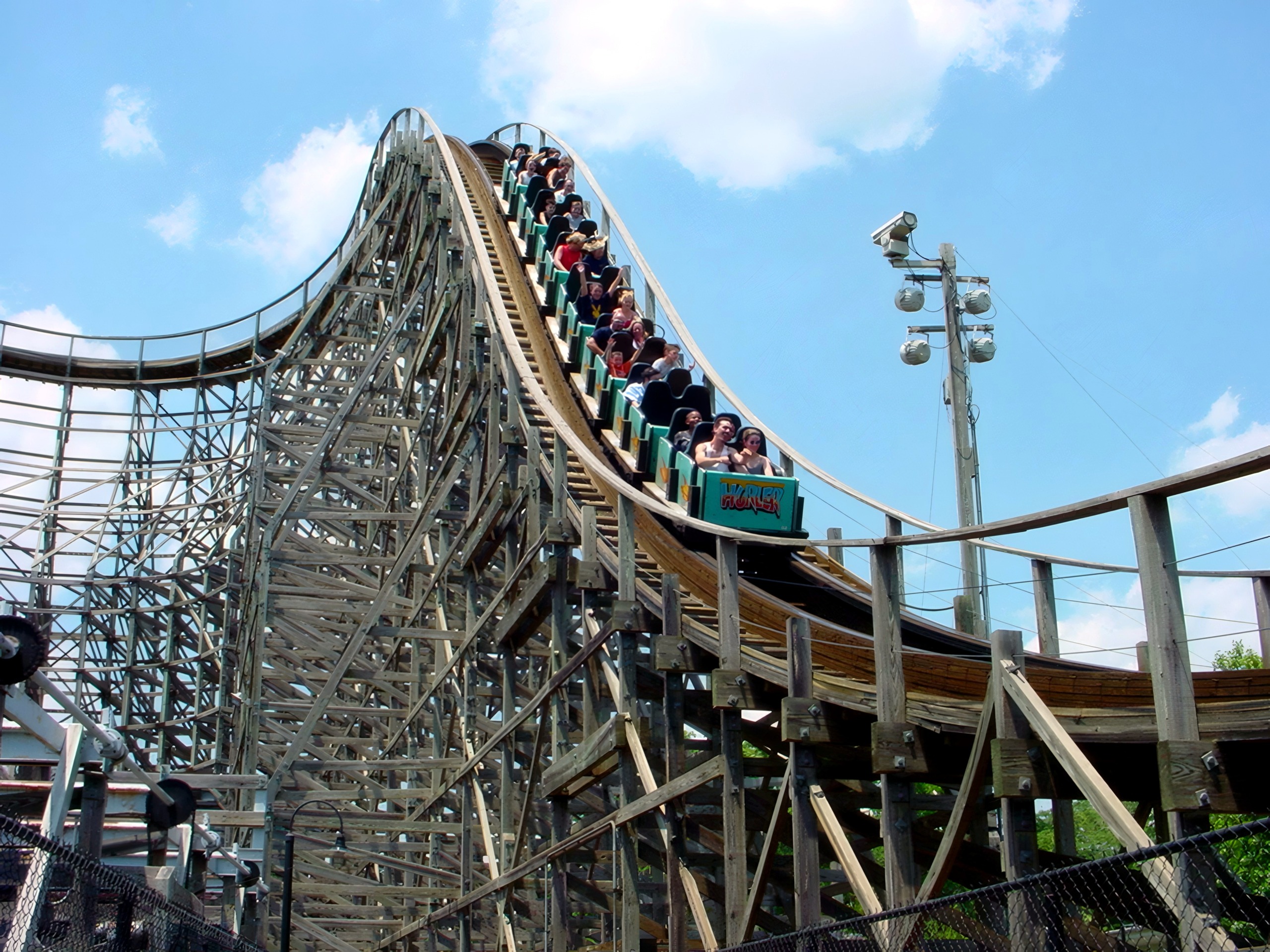 A Hurler train full of riders heading down the first drop at Kings Dominion, July 2001