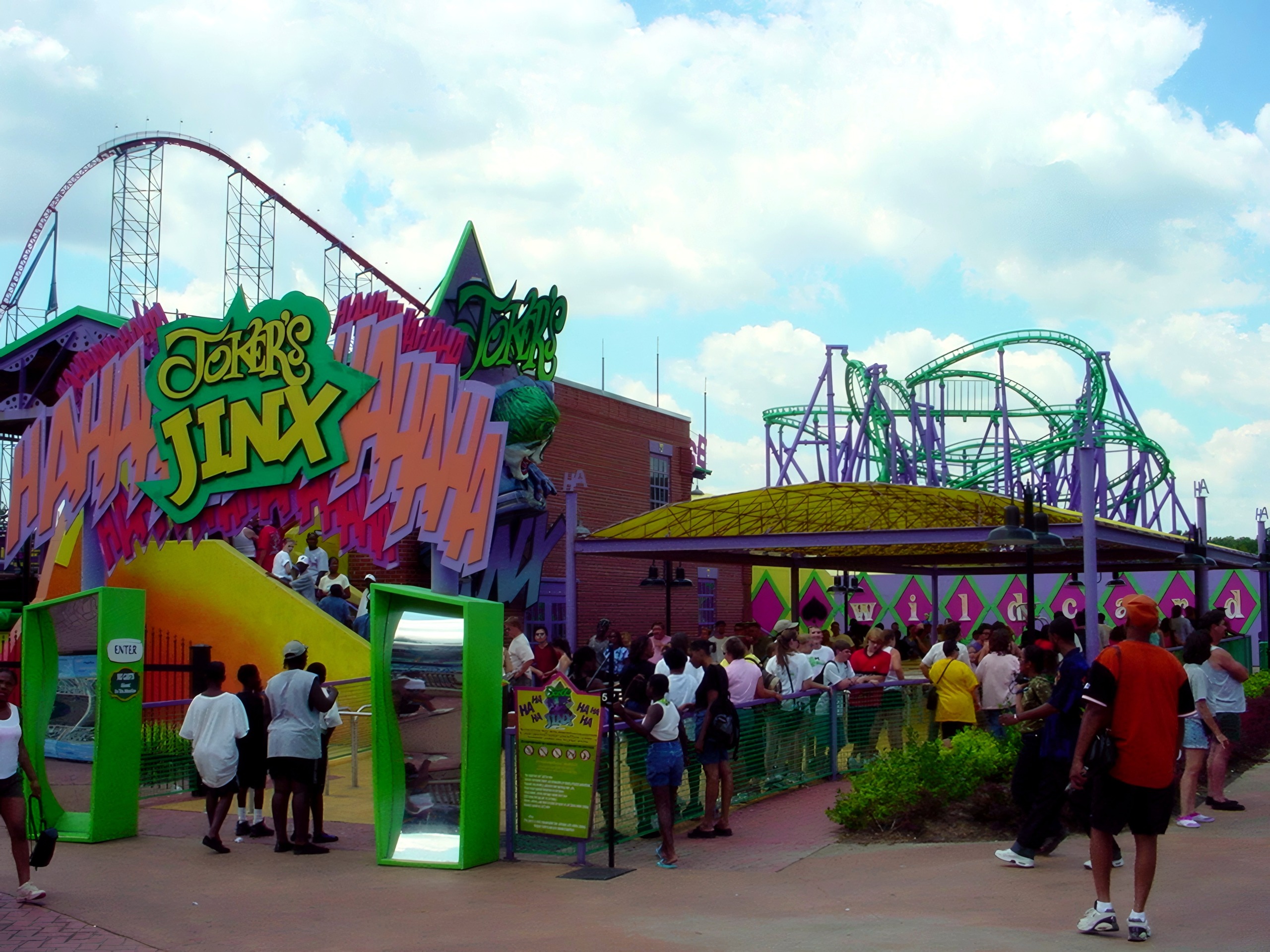 The Joker's Jinx entrance sign and station with the track behind at Six Flags America, July 2001