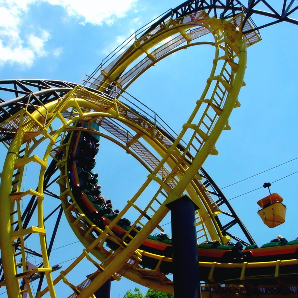 Loch Ness Monster at Busch Gardens Williamsburg: trains in both interlocking loops with a skyride gondola passing