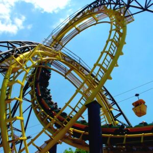 Loch Ness Monster at Busch Gardens Williamsburg: trains in both interlocking loops with a skyride gondola passing