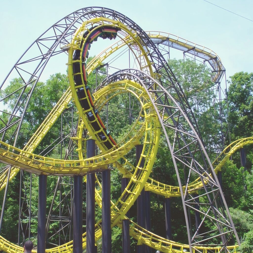 A Loch Ness Monster train in the interlocking loops seen from the bridge below at Busch Gardens Williamsburg