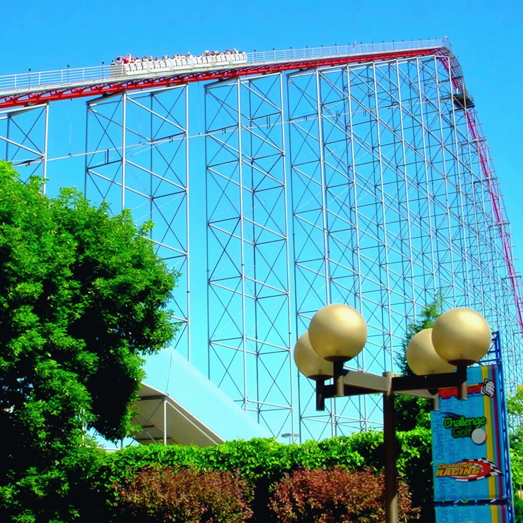 Magnum XL-200 at Cedar Point: a train cresting the lift hill above the globe lamp posts